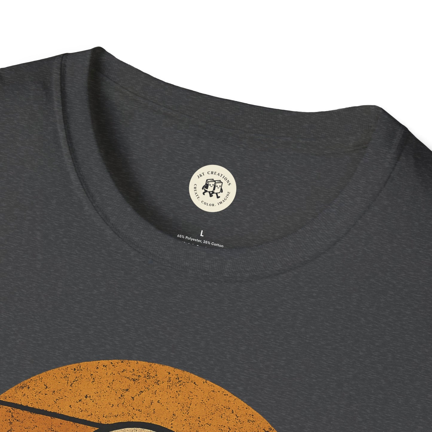 Close-up of a dark gray retro UFO t-shirt collar and partial orange graphic printed by Printify