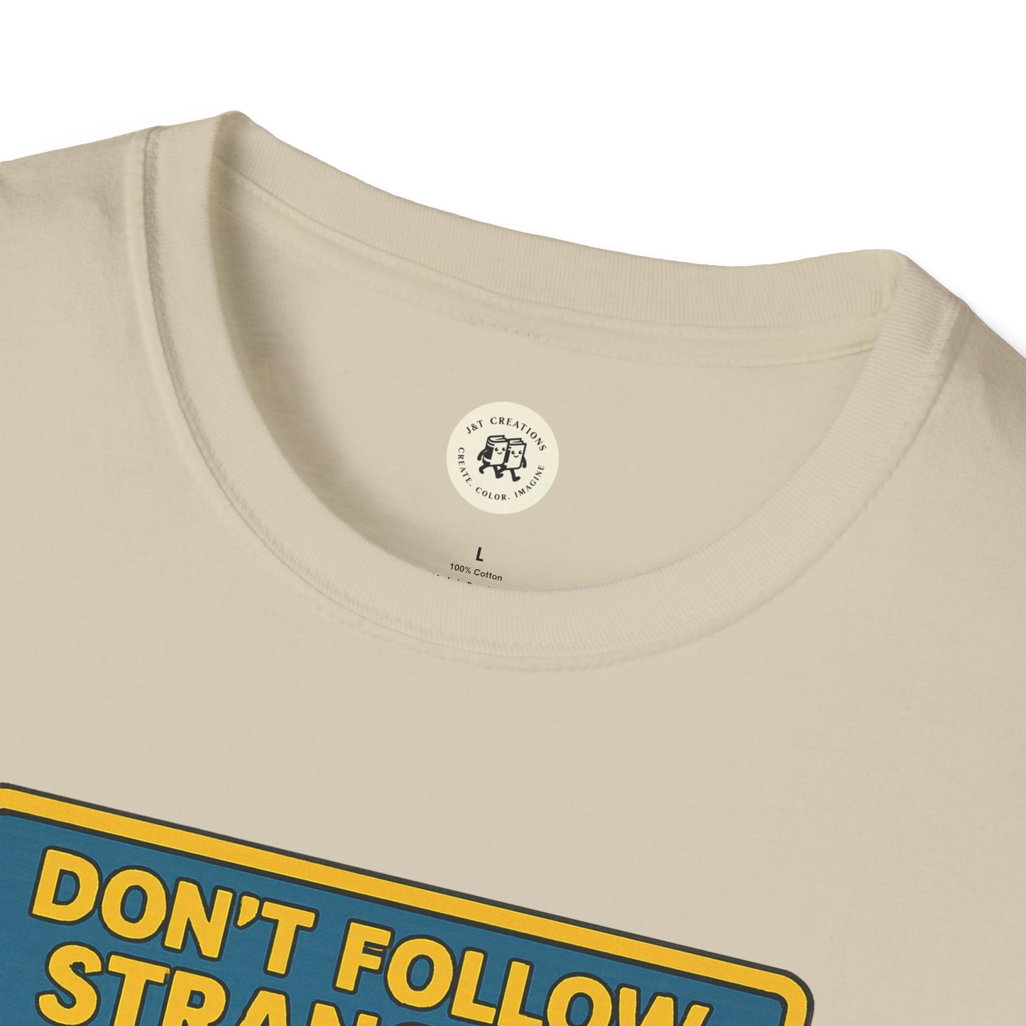 Printify Alice in Wonderland graphic tee close-up of collar and part of front design on beige t-shirt