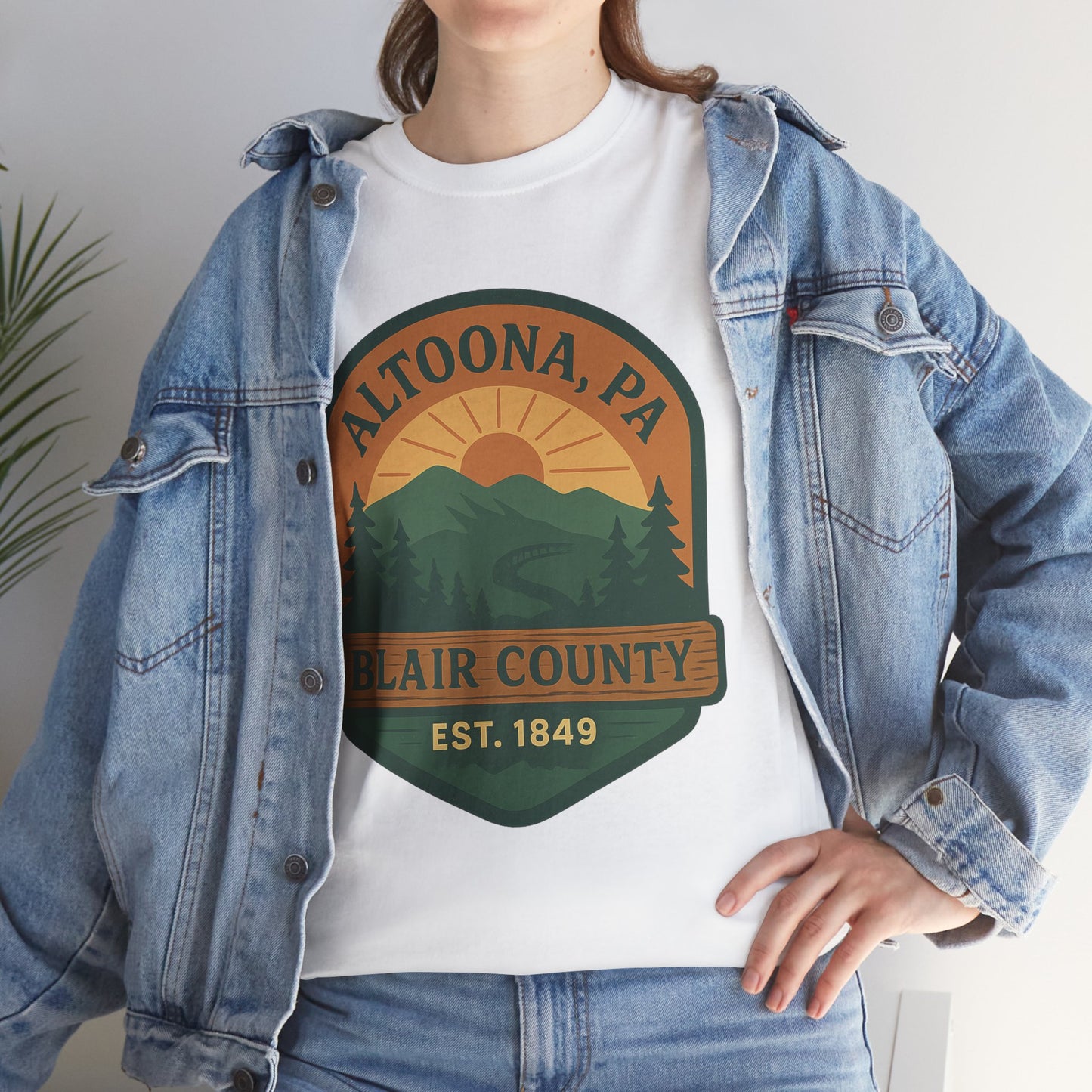 Altoona adventure t-shirt featuring scenic mountain and sunset design worn with denim jacket