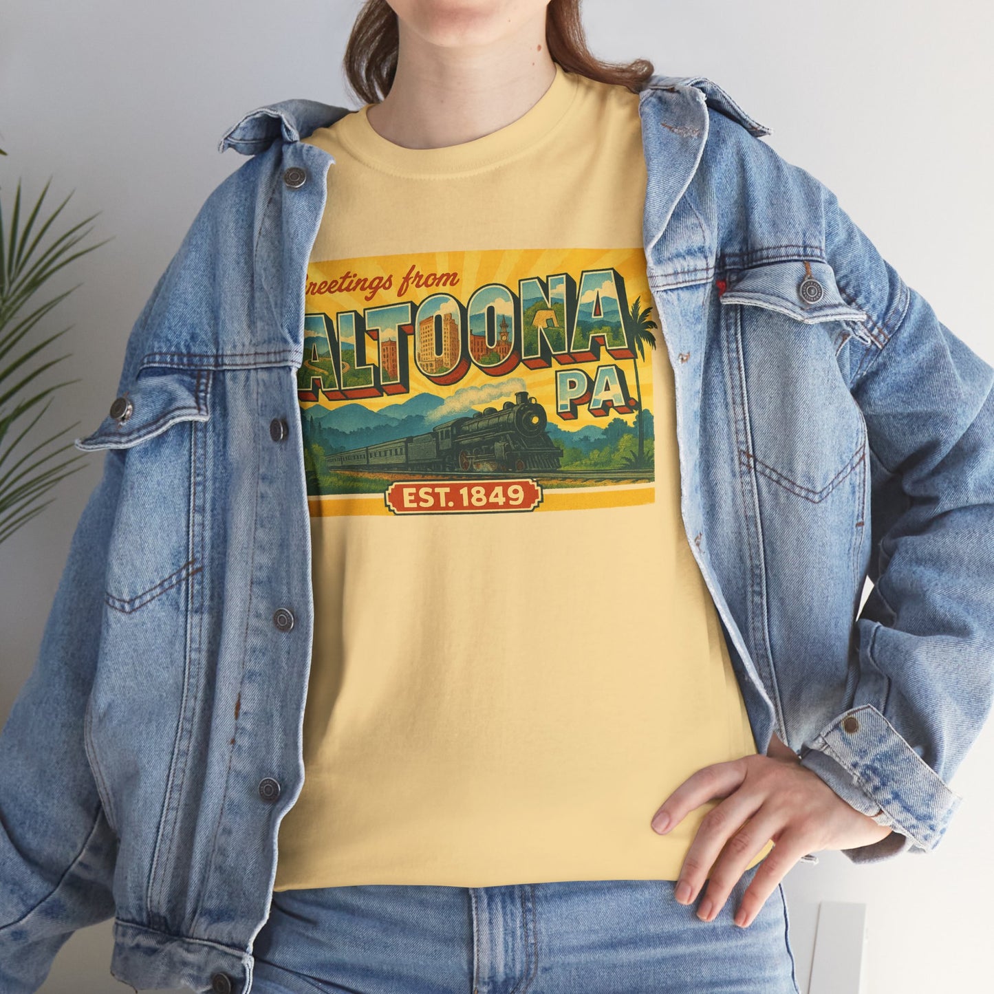 Yellow Altoona PA souvenir t-shirt with vintage train design worn under denim jacket