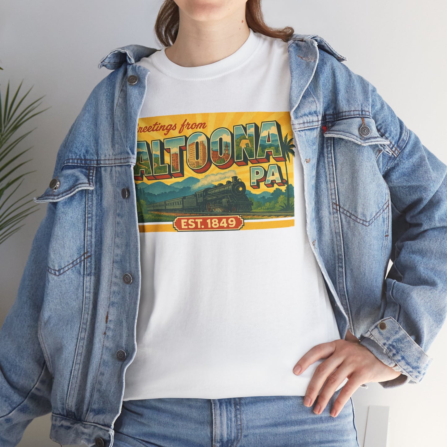 White Printify T-shirt with vintage greetings from Altoona PA souvenir t-shirt design worn with denim jacket