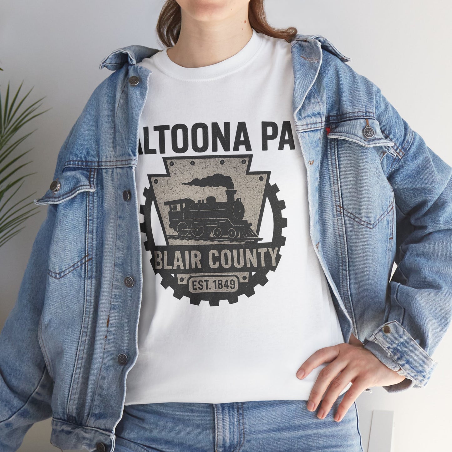 White Altoona PA t-shirt featuring a vintage train design and Blair County emblem worn with denim jacket
