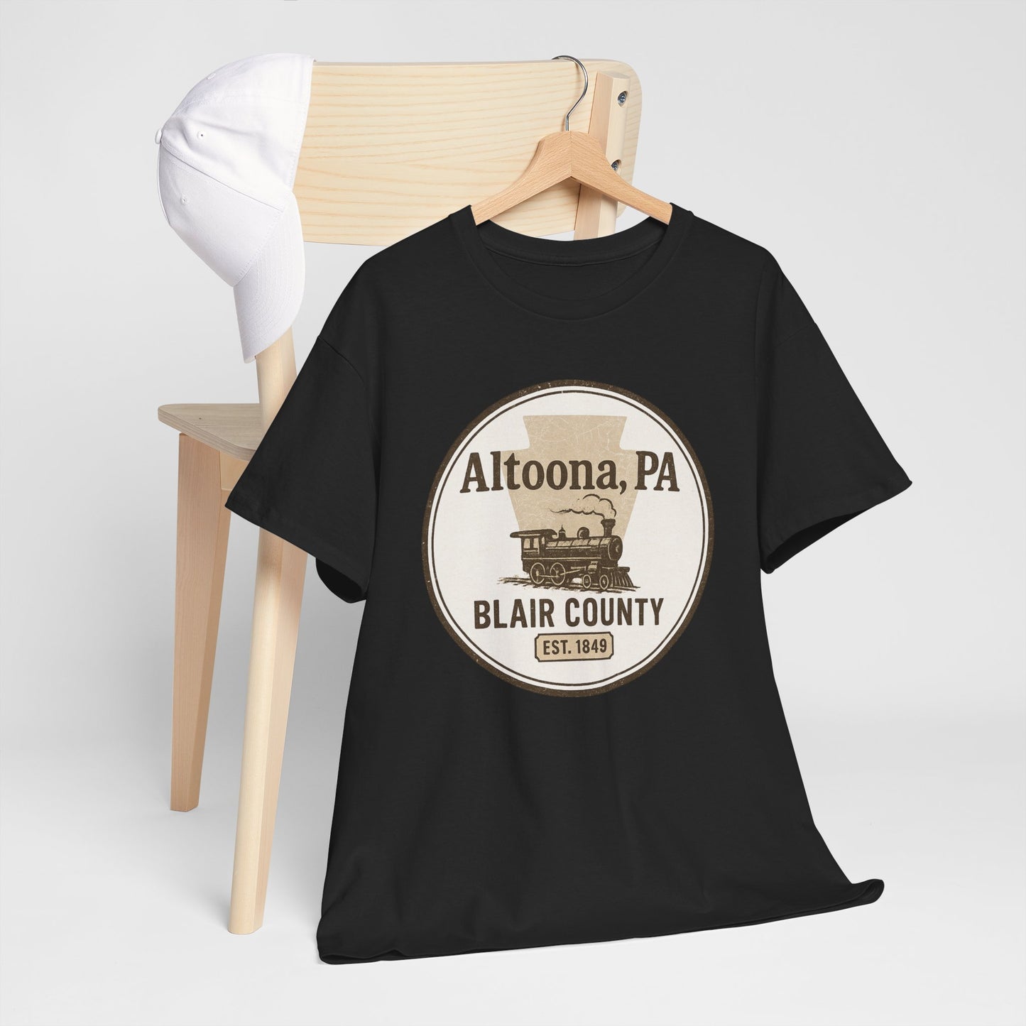 Black Altoona PA vintage t-shirt with Blair County train design hanging on wooden chair