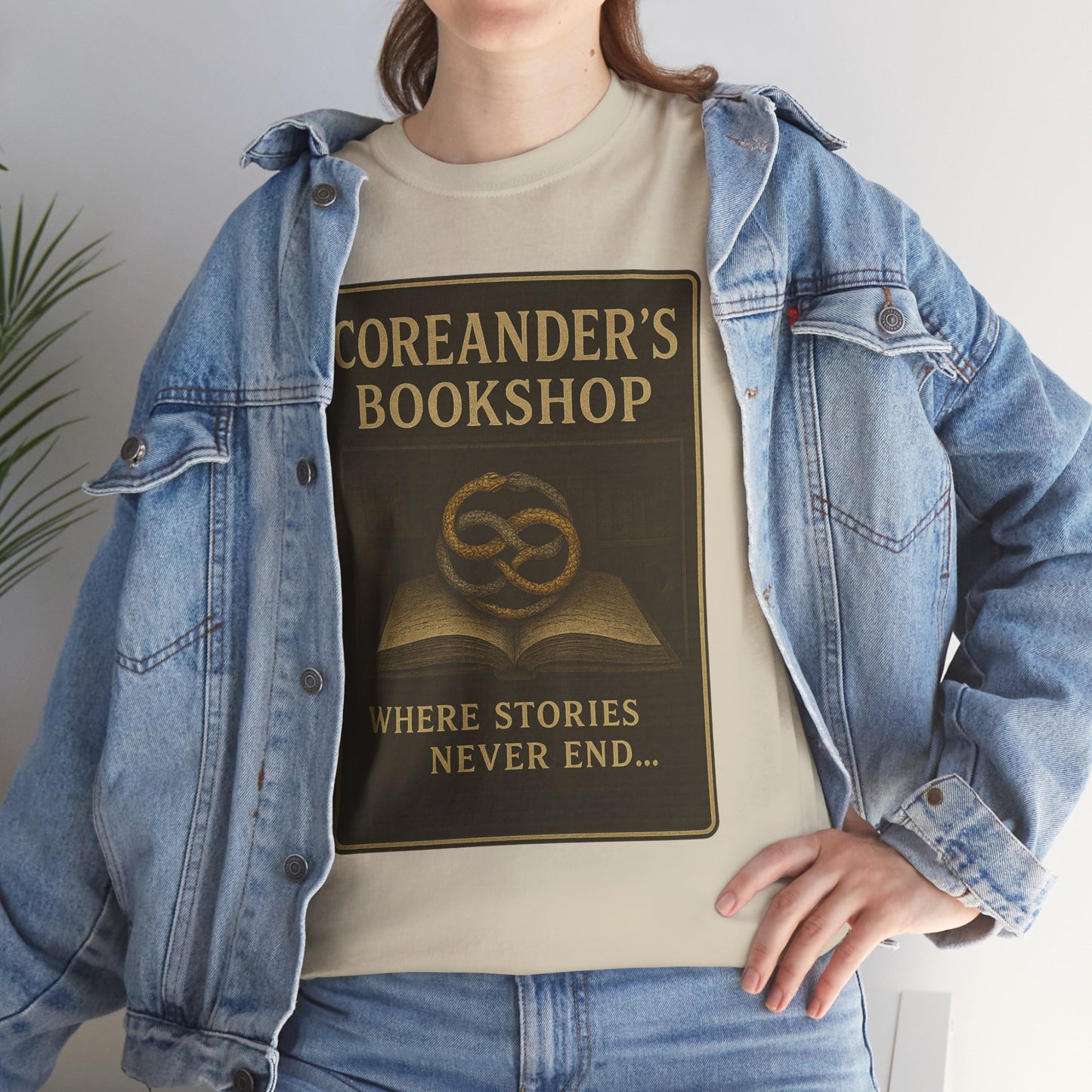 Neverending Story t-shirt by Printify featuring Coreander's Bookshop design with open book and text