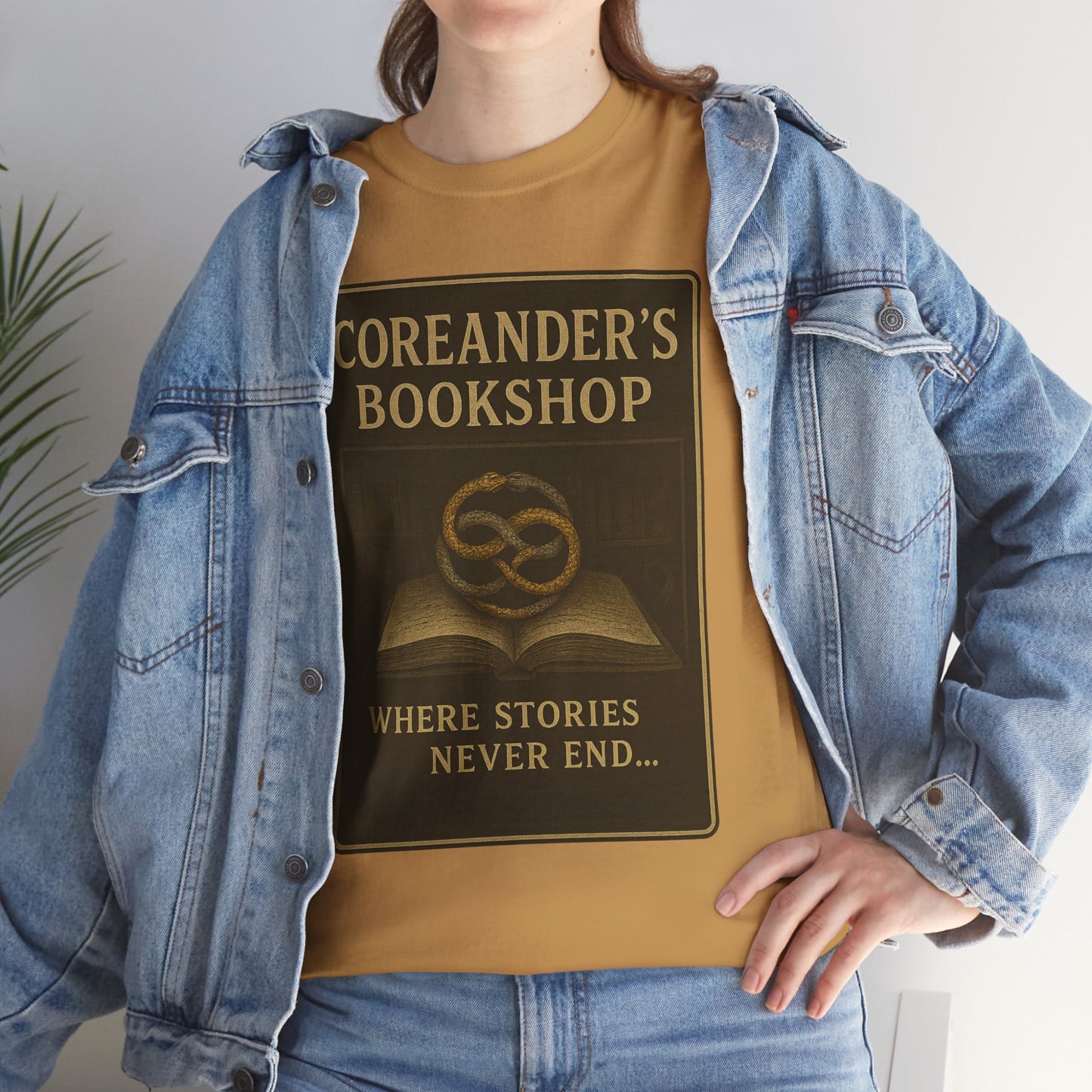 Neverending Story t-shirt in brown with Coreander's Bookshop print featuring a book and symbol