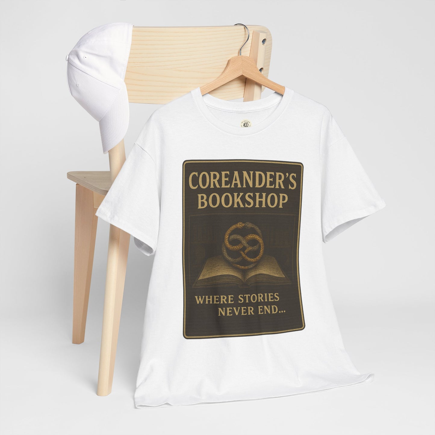 White Neverending Story t-shirt by Printify featuring Coreander's Bookshop design with book and quote