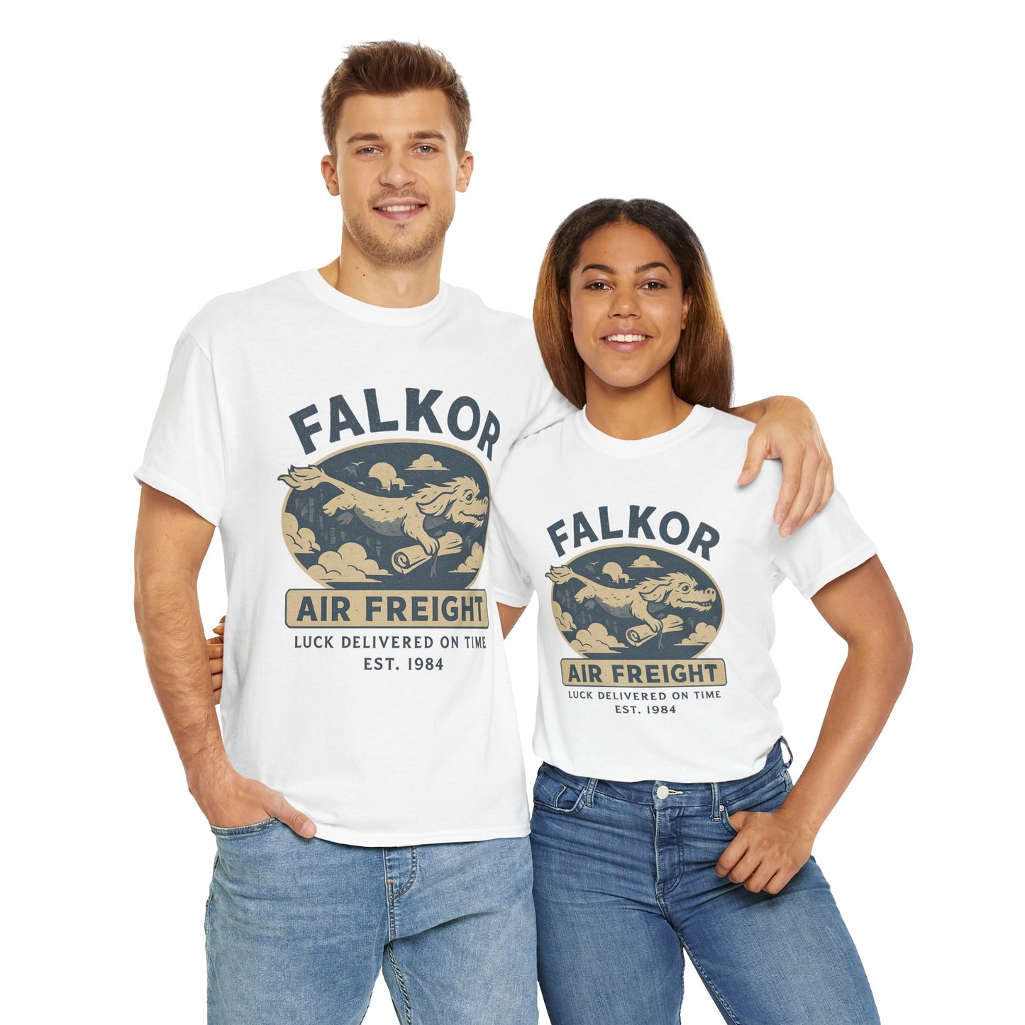 Couple wearing Printify Falkor Neverending Story t-shirt with vintage air freight graphic in white