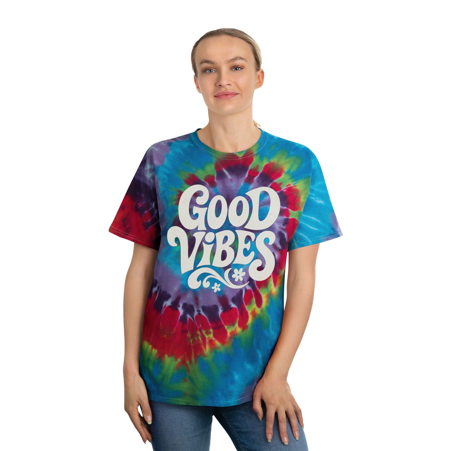 Woman wearing Printify festival tie dye t shirt with Good Vibes graphic in vibrant colors