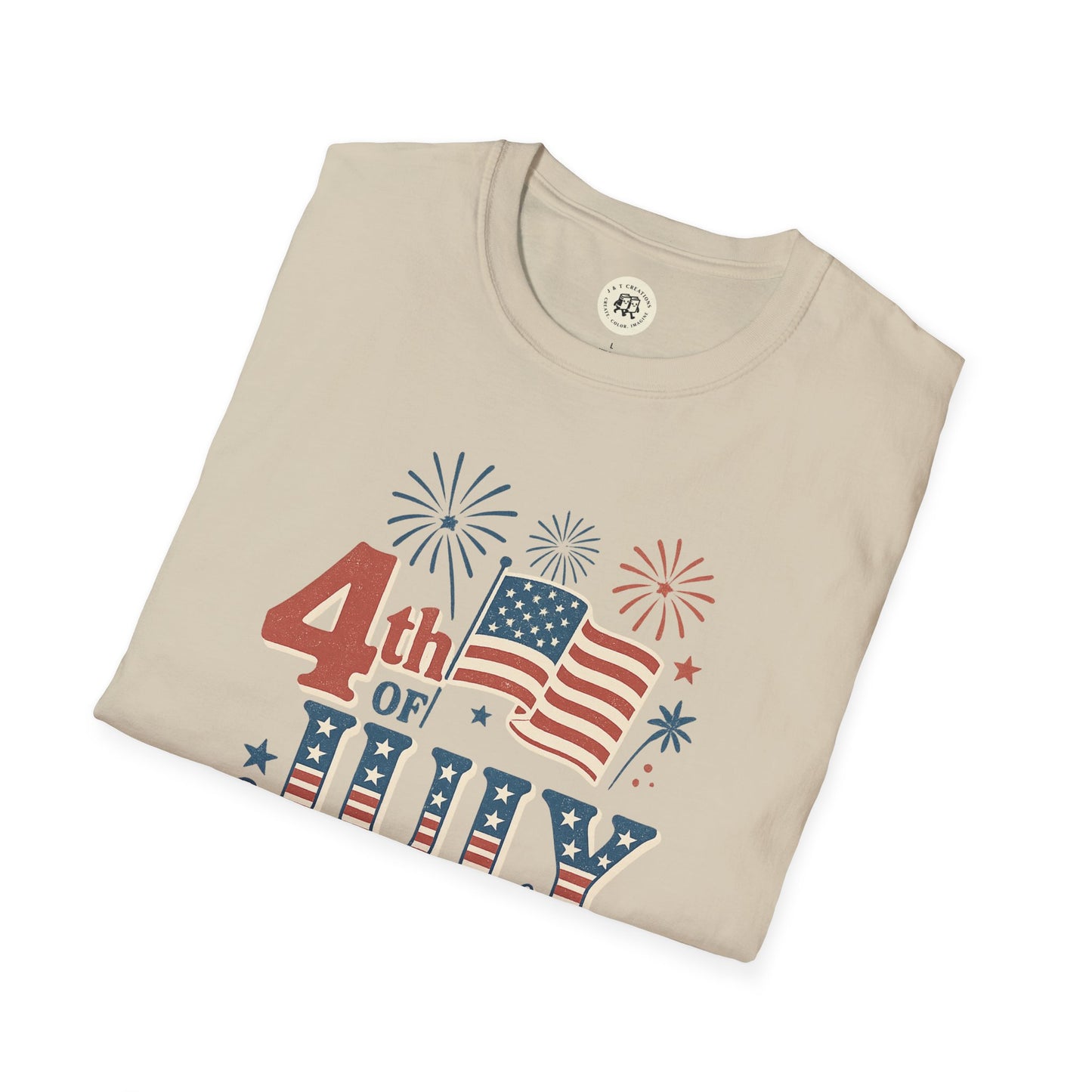 Folded beige Printify t-shirt featuring Fourth of July fireworks shirt design with American flag and festive fireworks