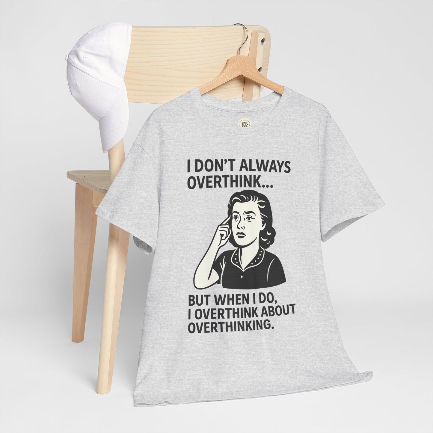 Printify funny overthinking t-shirt in gray with humorous overthinker graphic hanging on wooden chair