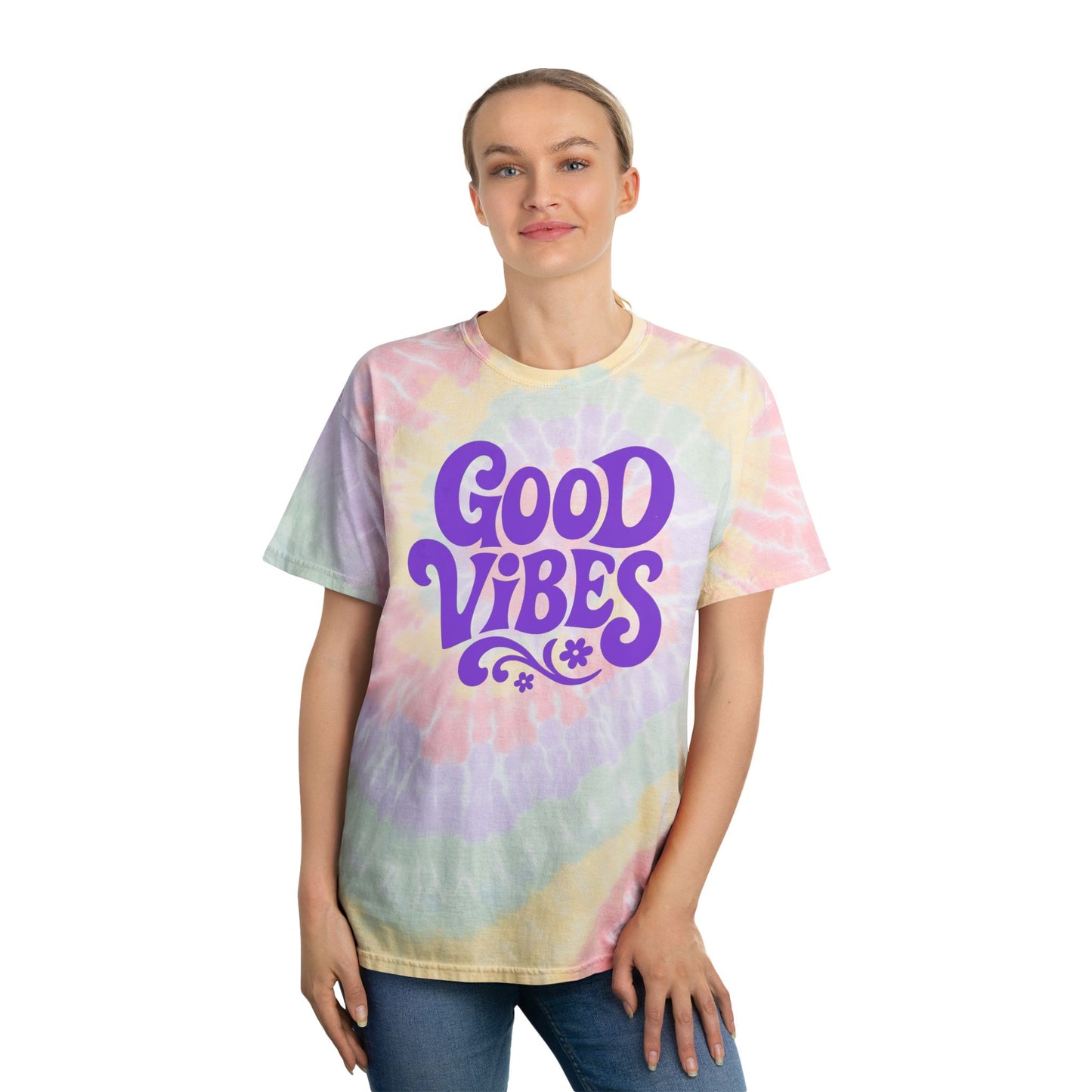Printify rainbow tie-dye t-shirt with purple Good Vibes text worn by woman