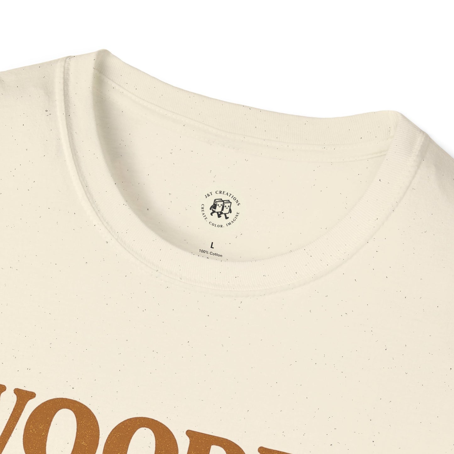 Close-up of a cream Printify wooden spoon survivor t-shirt with a round neckline and speckled fabric