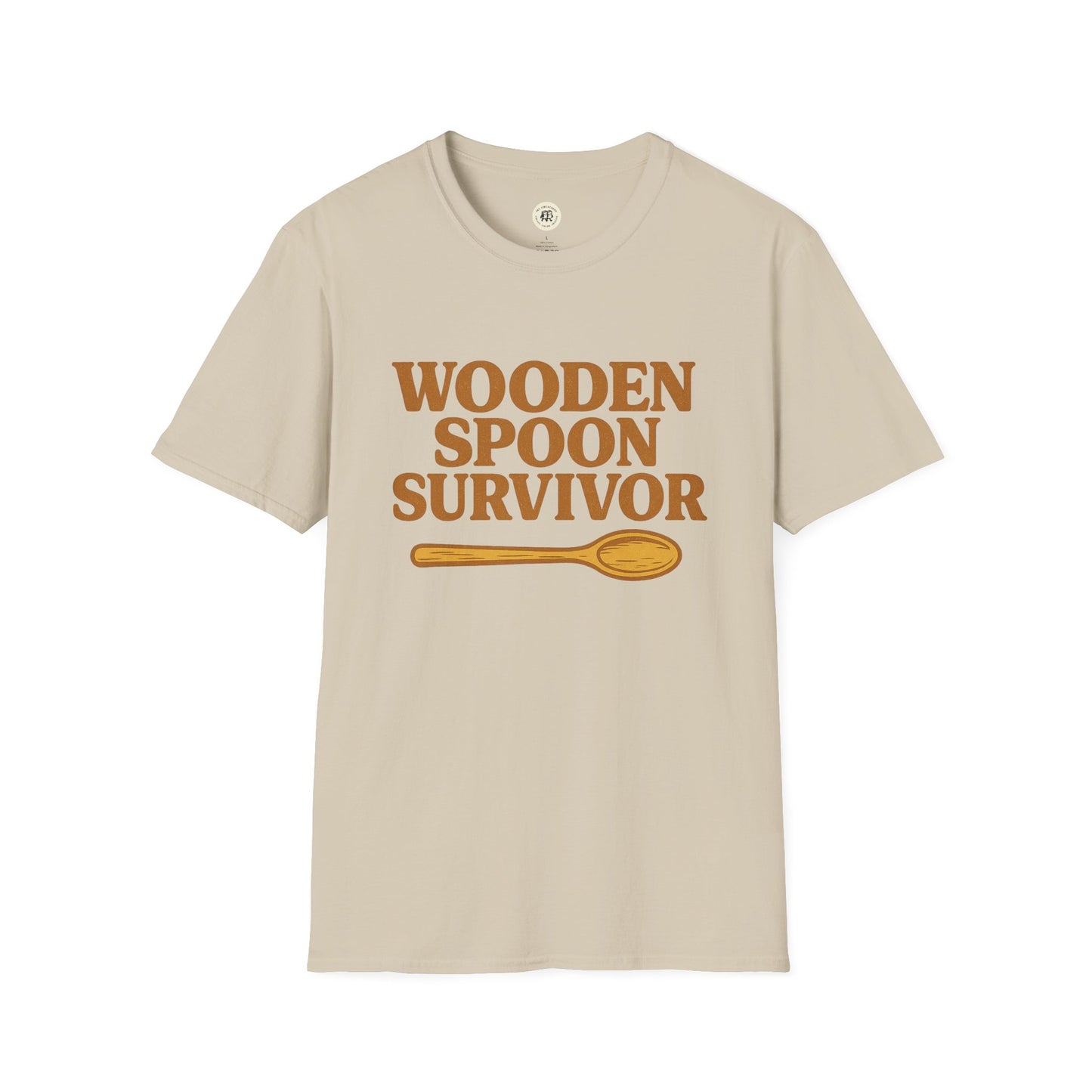 Beige Printify wooden spoon survivor t-shirt with brown text and wooden spoon graphic