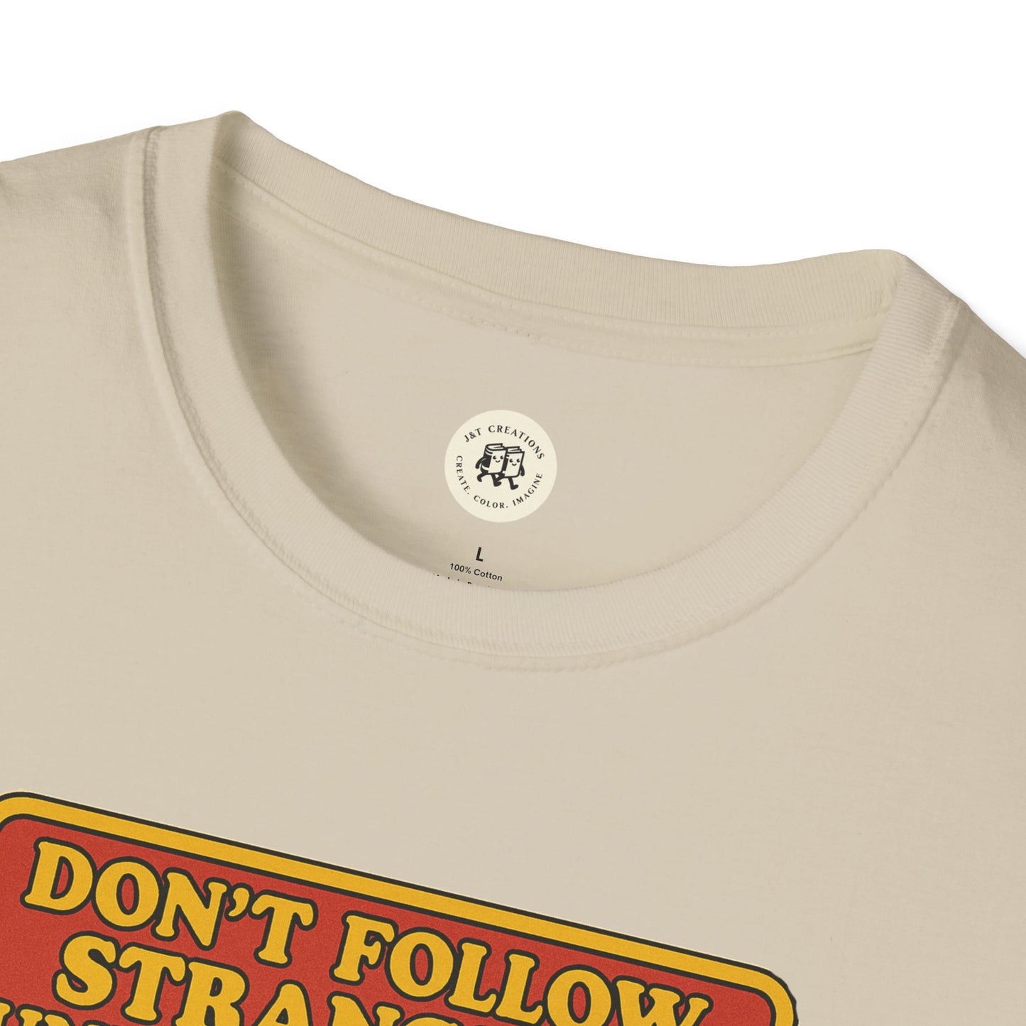 Close-up of cream-colored phantom of the opera t-shirt with bold vintage text design by Printify