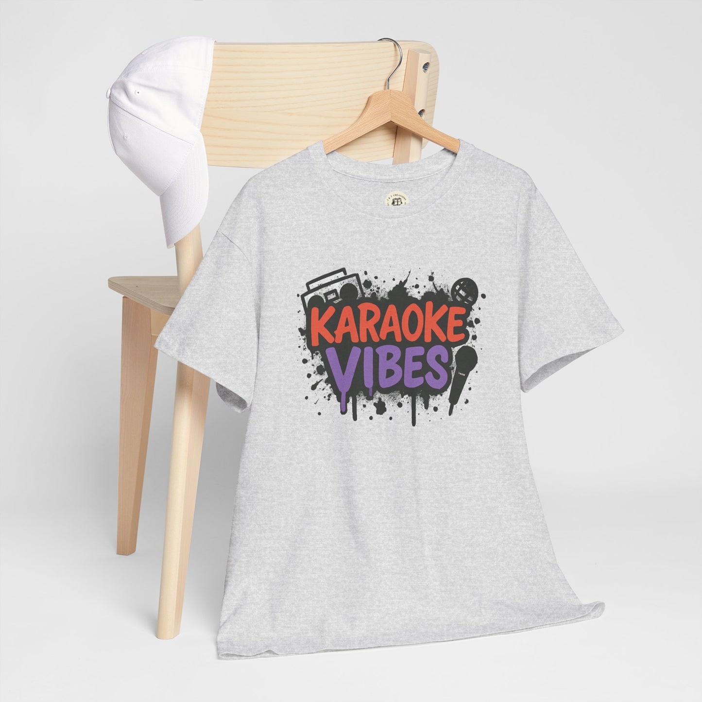 Gray Printify karaoke t-shirt for parties with colorful karaoke vibes graphic hung on wooden chair