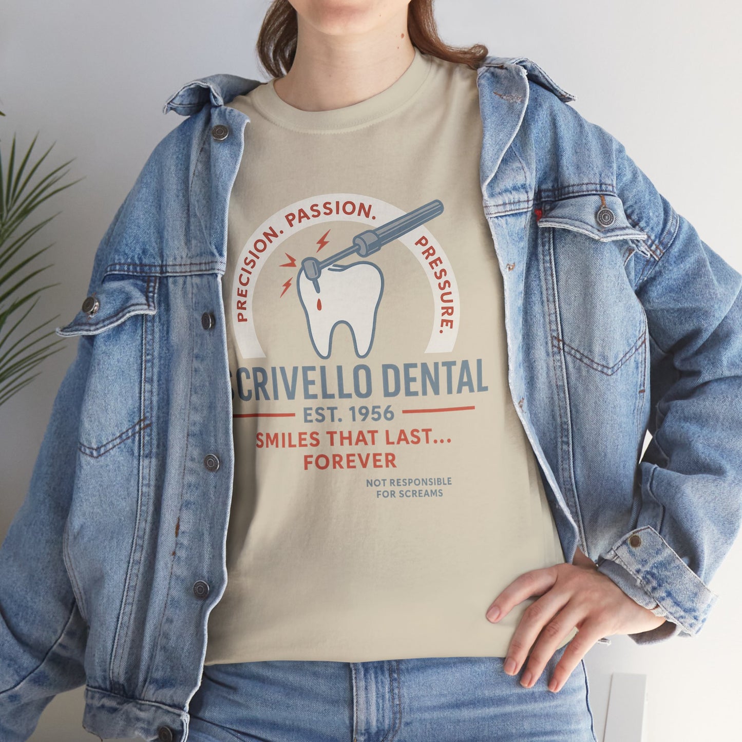 Beige Little Shop of Horrors t-shirt with Crivello Dental graphic worn under denim jacket