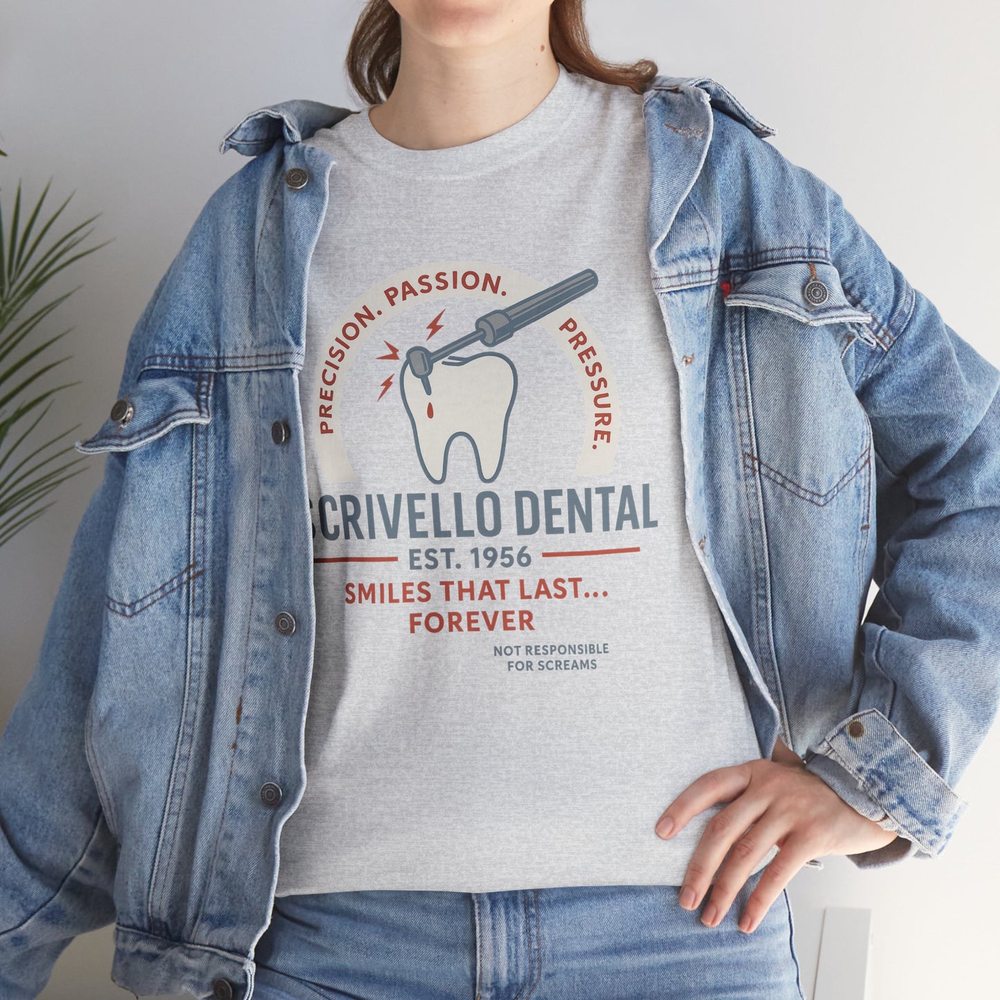 Printify Little Shop of Horrors t-shirt with Crivello Dental graphic and text worn with denim jacket