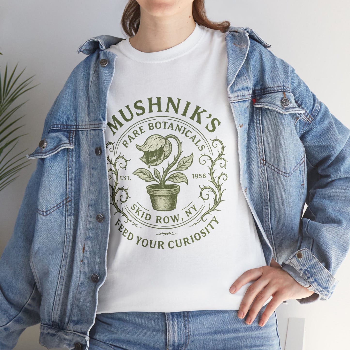 Printify Little Shop of Horrors t-shirt featuring Mushnik's Rare Botanicals plant design on white fabric