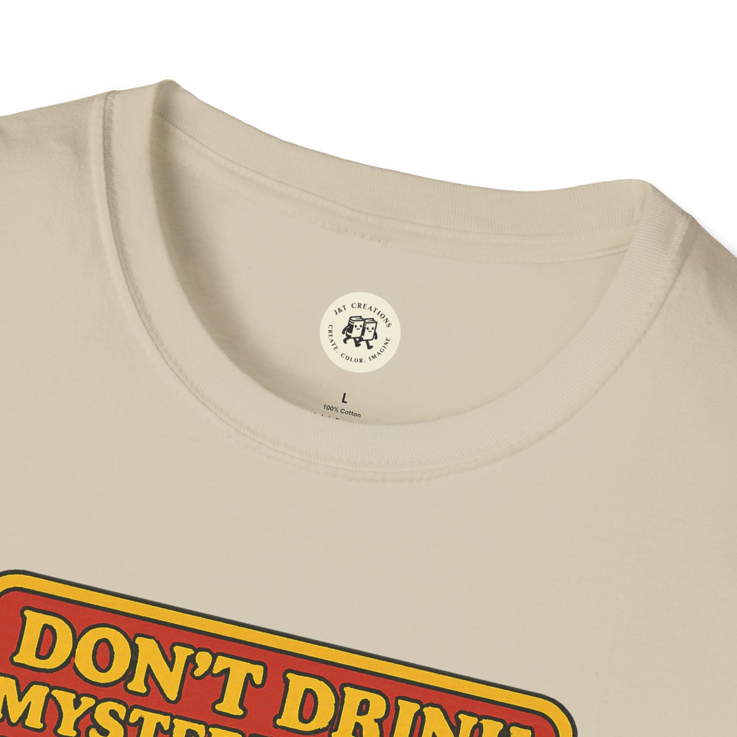 Close-up of Printify mad hatter food safety shirt beige cotton t-shirt neckline and partial print