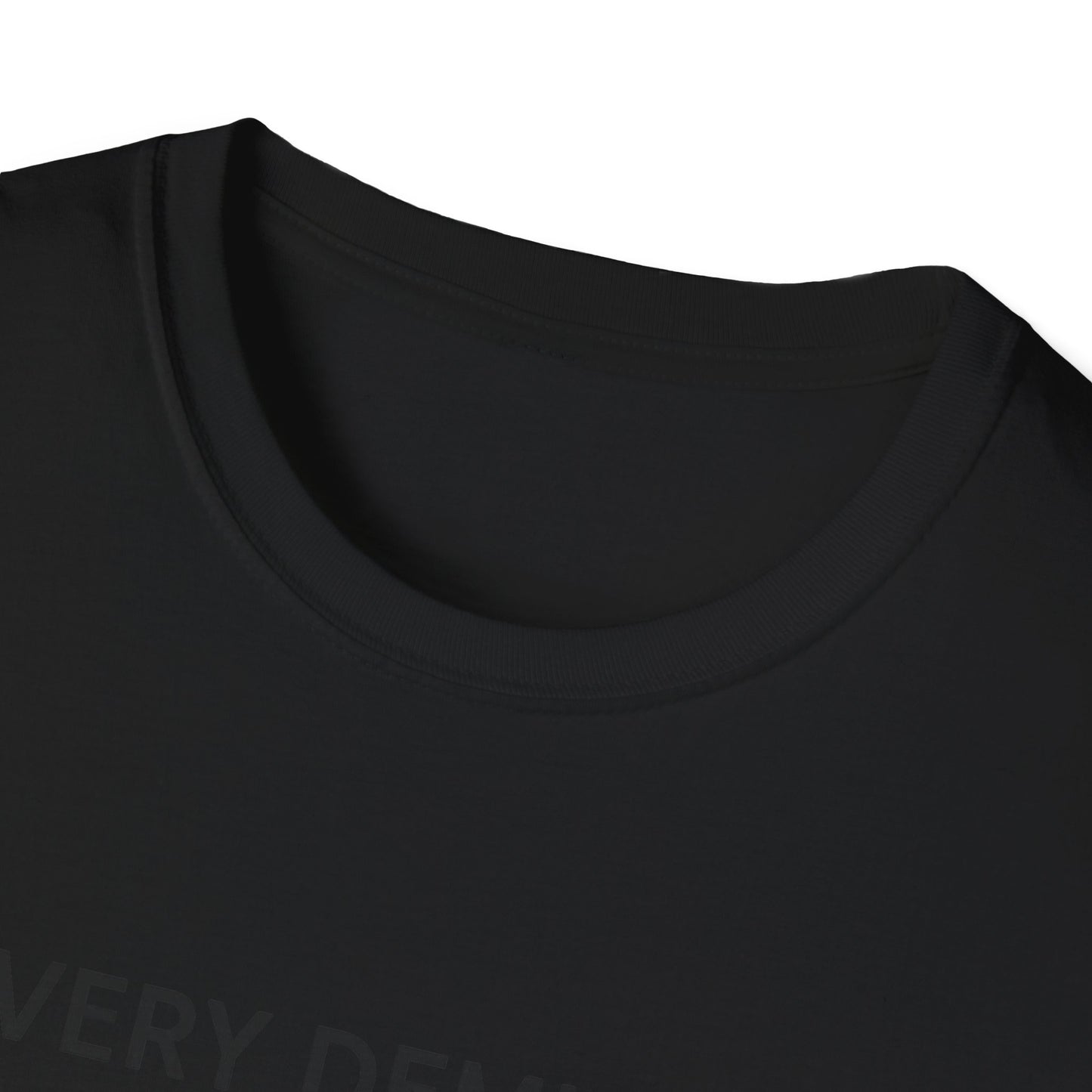 Close-up of black Printify mindfulness graphic t-shirt neckline and collar stitching