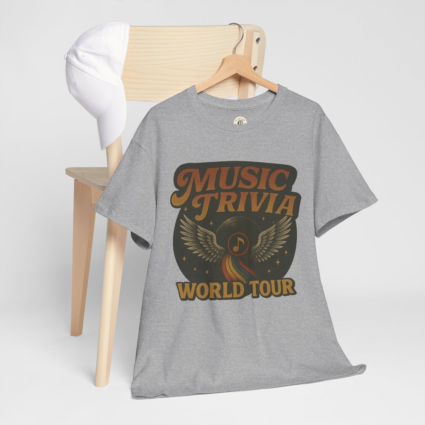 Gray music trivia t-shirt with vintage style music note and wings design hanging on wooden chair