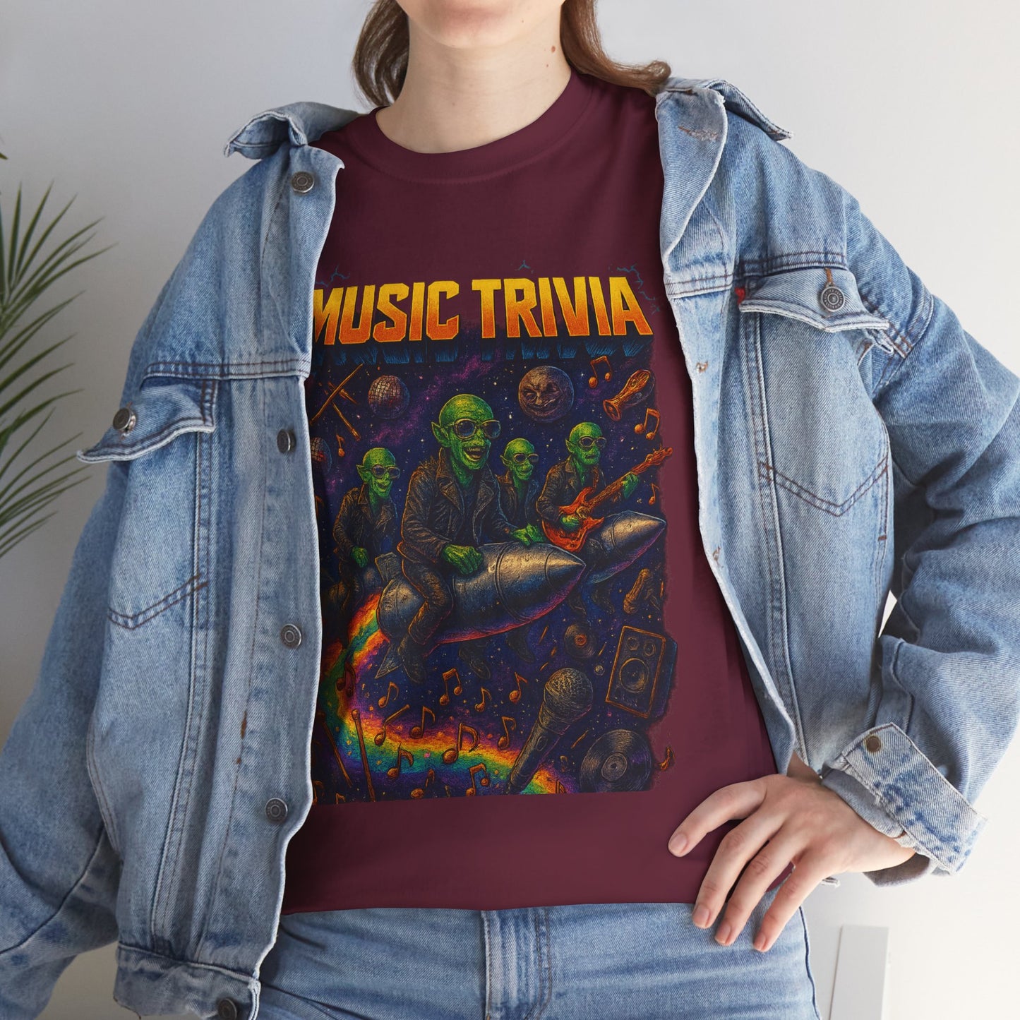 Maroon music trivia t-shirt with colorful alien musicians and musical instruments graphic worn with denim jacket