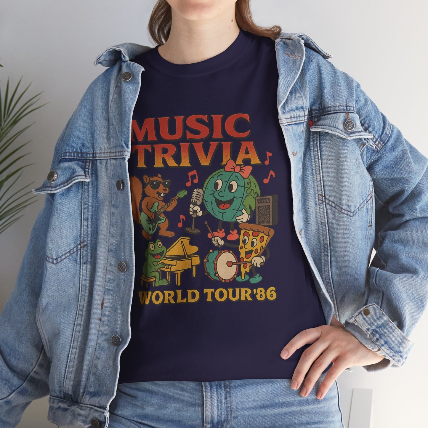 Navy blue music trivia t-shirt with cartoon characters and world tour 86 design worn with denim jacket