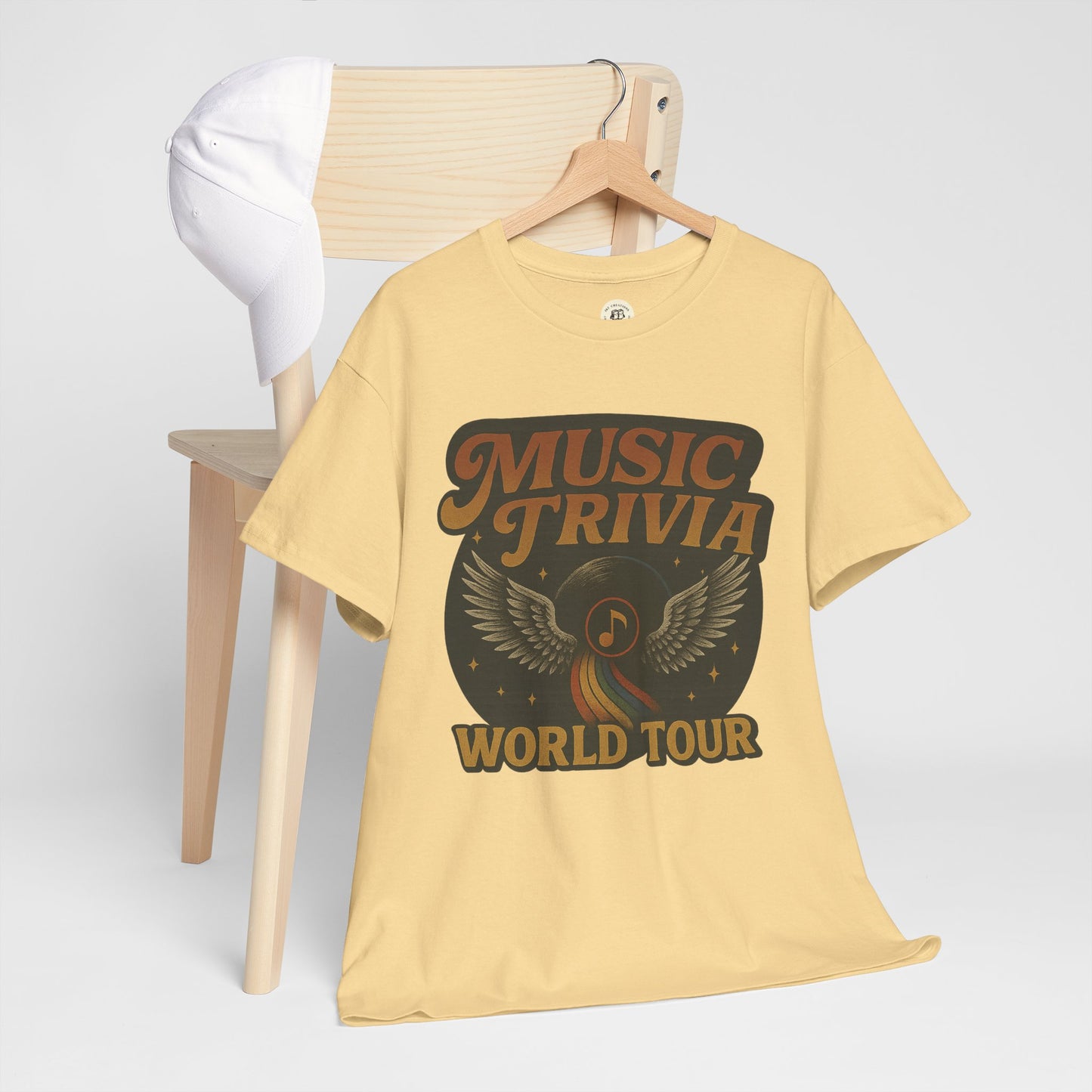 Beige Printify music trivia t-shirt with vintage wings and world tour design on front