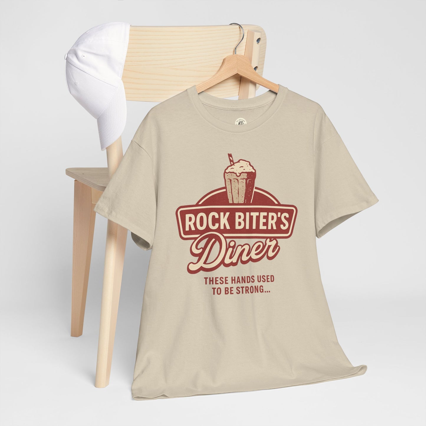 Beige Neverending Story diner t-shirt with Rock Biter's Diner graphic and text design by Printify