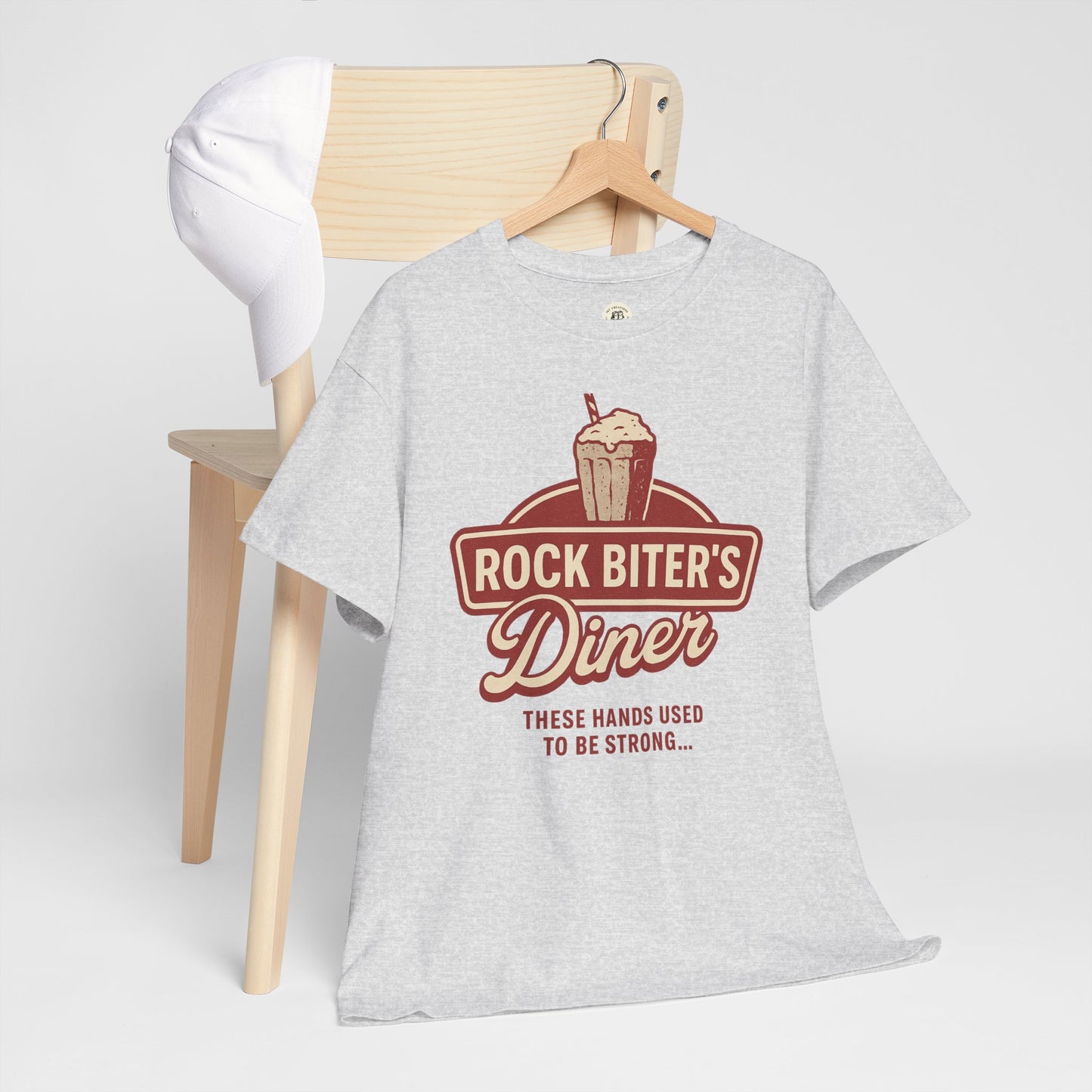 Gray Neverending Story diner t-shirt with Rock Biter's Diner graphic and slogan displayed on hanger