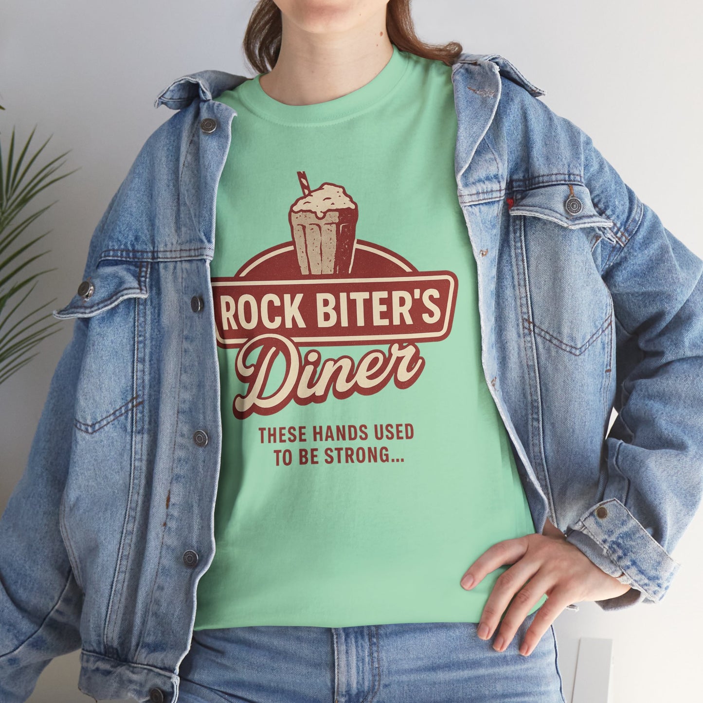 Mint green Neverending Story diner t-shirt with vintage Rock Biter's Diner graphic worn under denim jacket