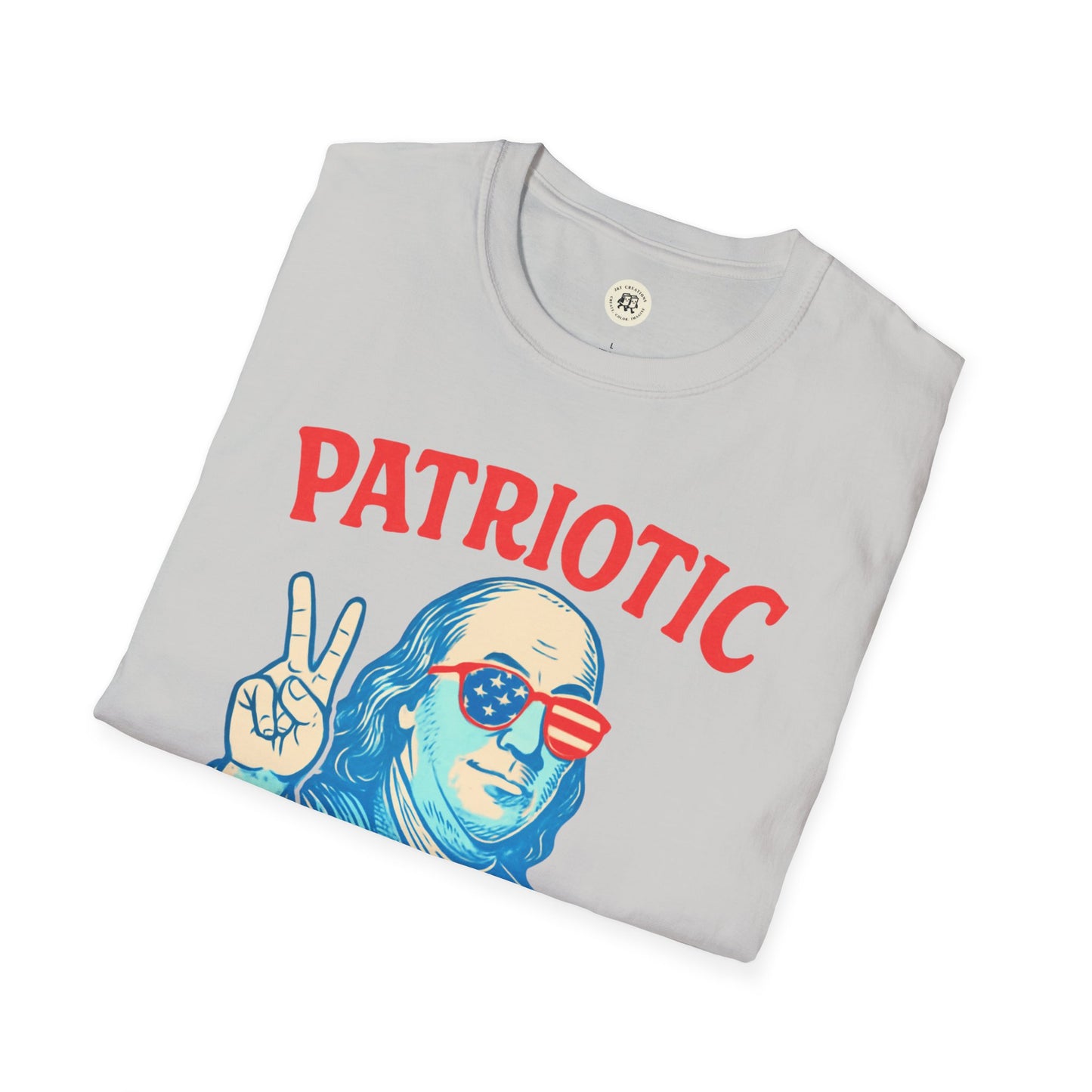 Folded gray Patriotic Ben Franklin t-shirt with red text and graphic of Ben Franklin wearing American flag sunglasses