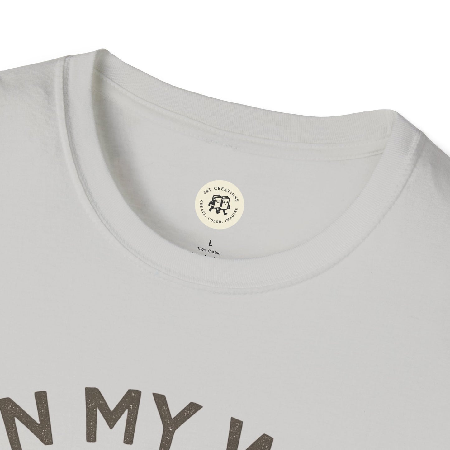 Close-up of white quirky duck t-shirt collar and neckline by Printify with partial text design