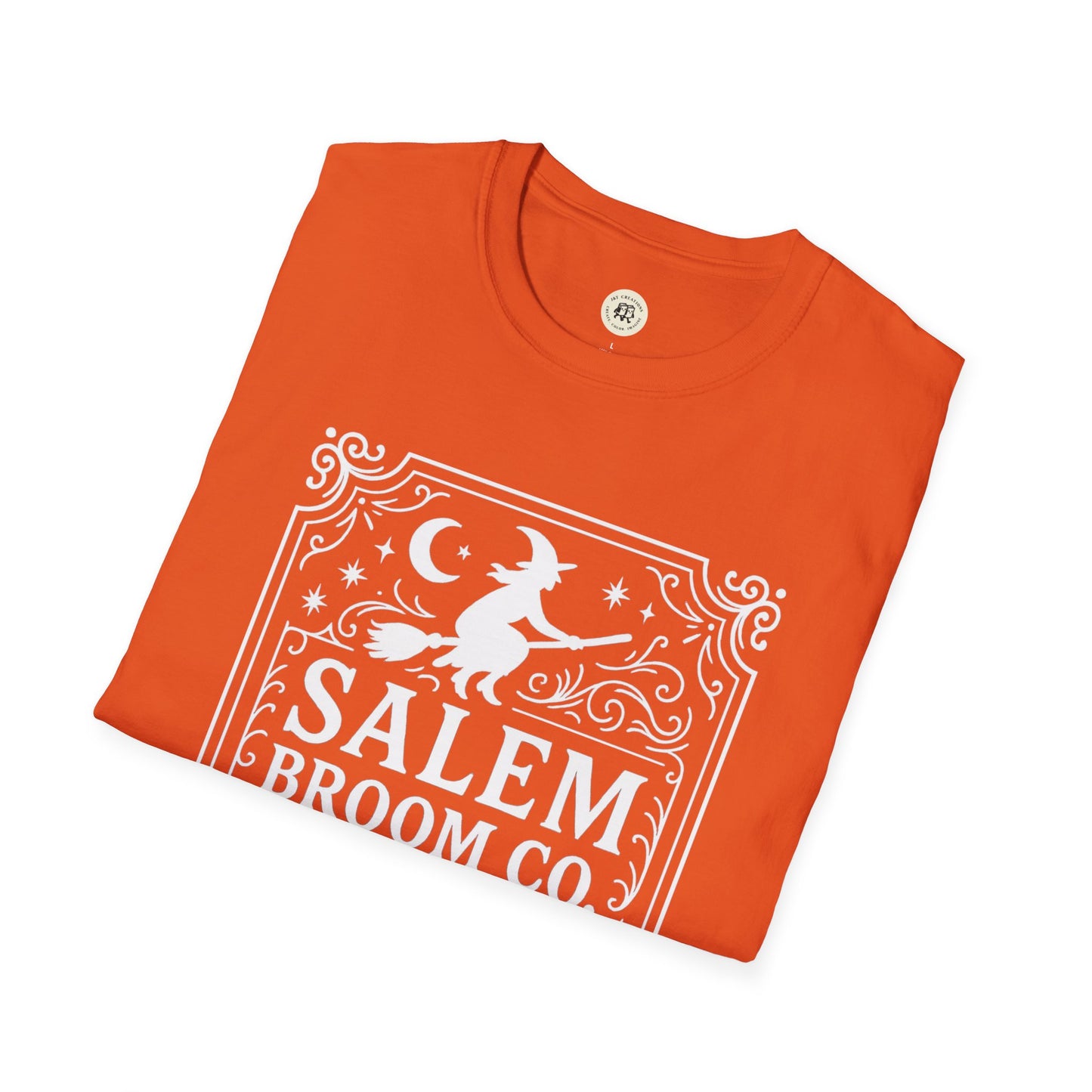 Orange Salem Broom Co. t-shirt with white witch and broom graphic on front by Printify