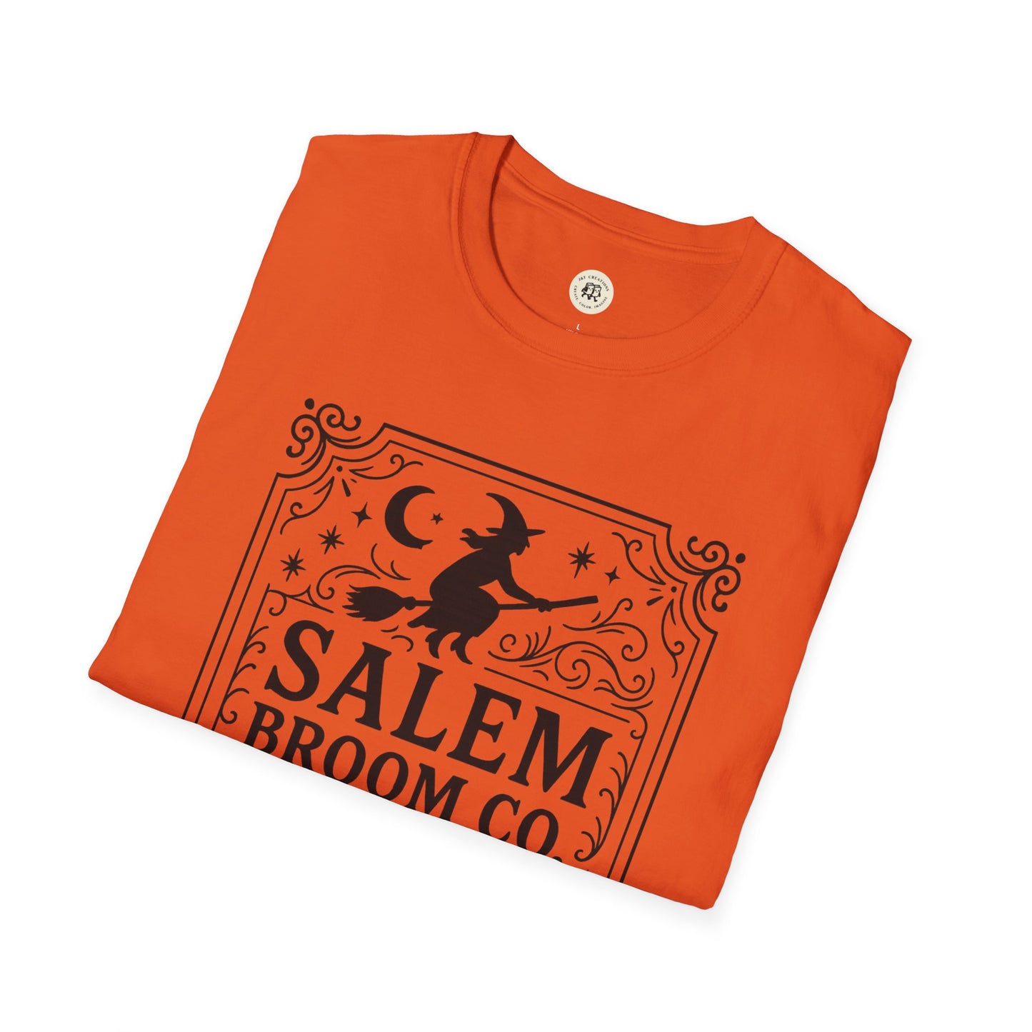 Orange witchy Halloween t-shirt with Salem Broom Co design and a witch flying on a broomstick