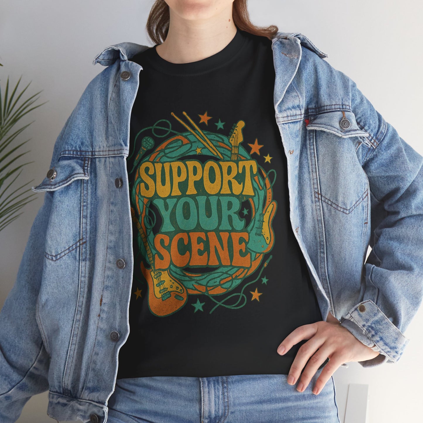 Support your scene t-shirt in black with colorful guitar and music design worn under denim jacket