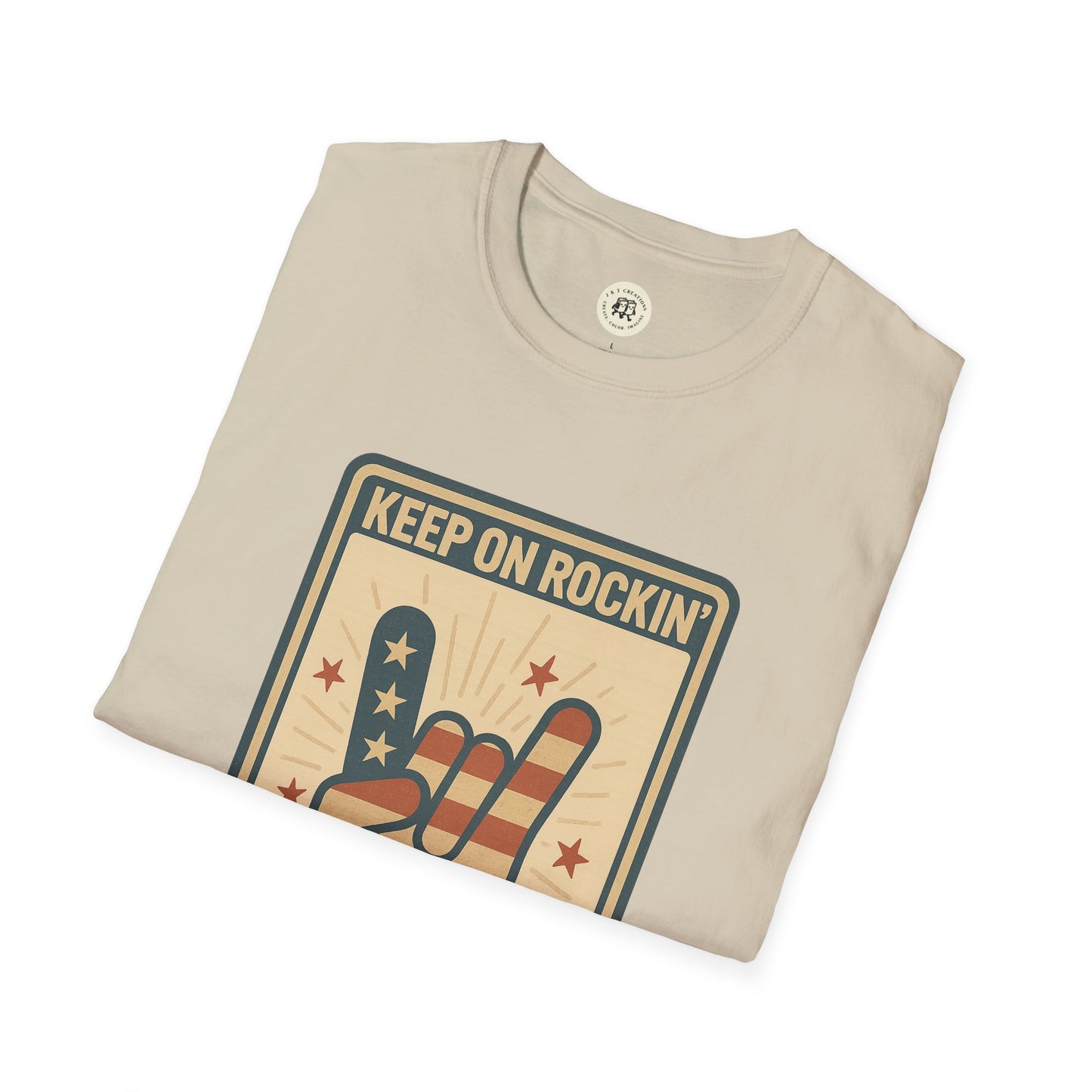 Beige Keep on Rockin in the Free World t-shirt with patriotic rock hand graphic folded flat