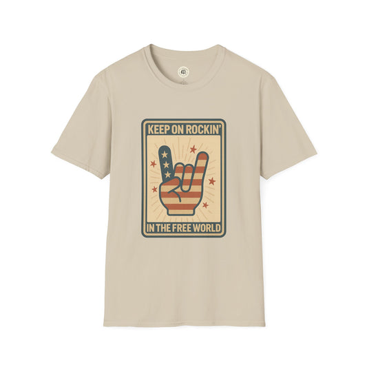 Beige Keep on Rockin in the Free World t-shirt with American flag hand rock gesture graphic