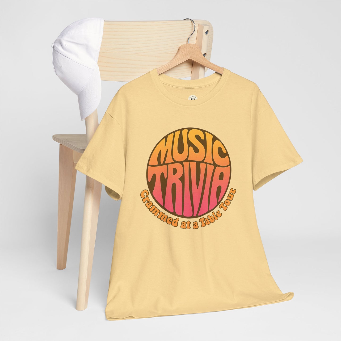 Printify vintage music trivia t-shirt in yellow with retro style graphic and text on wooden hanger