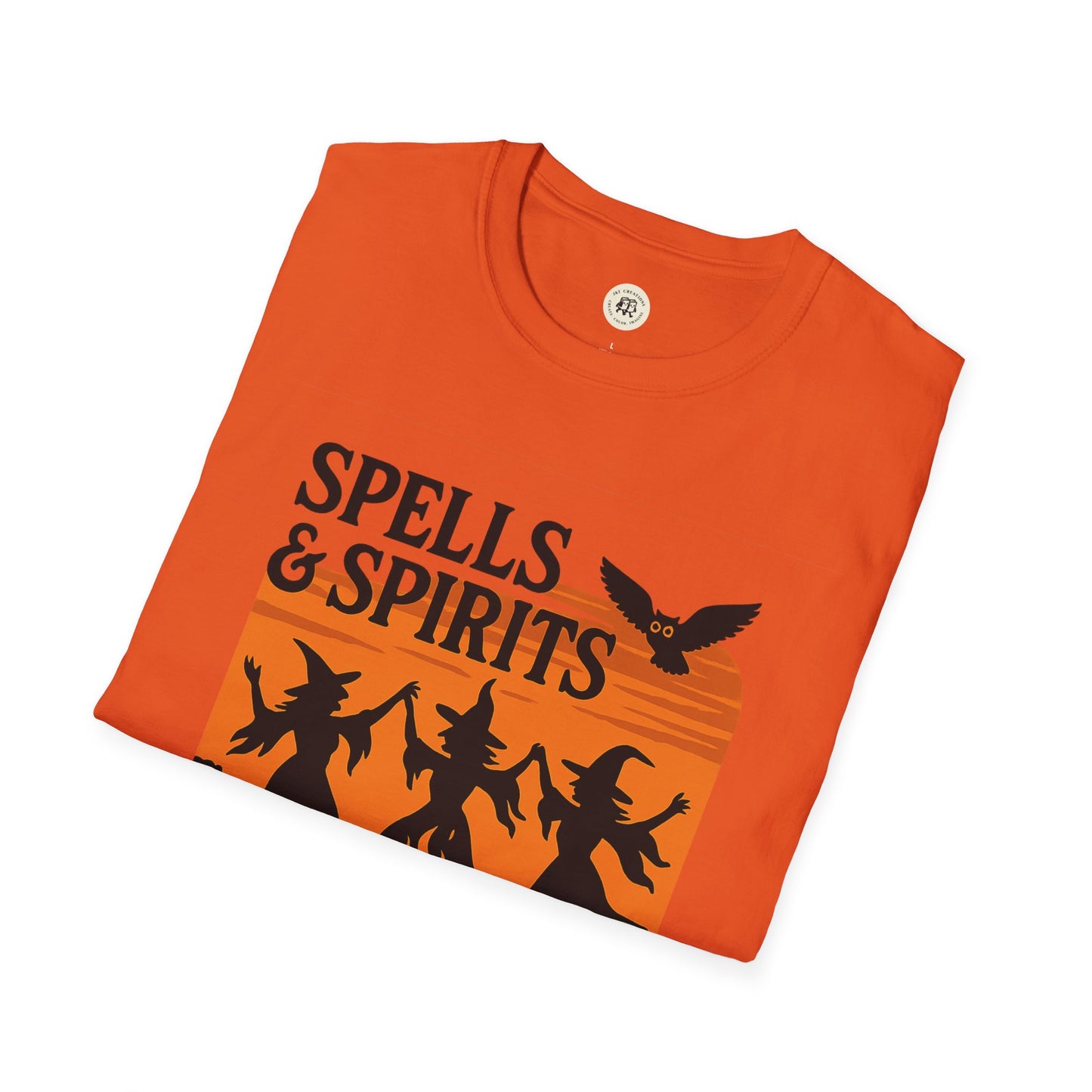 Orange folded Printify t shirt with Spells and Spirits witches and owl over sunset stripes spooky vibes unisex halloween t-shirt