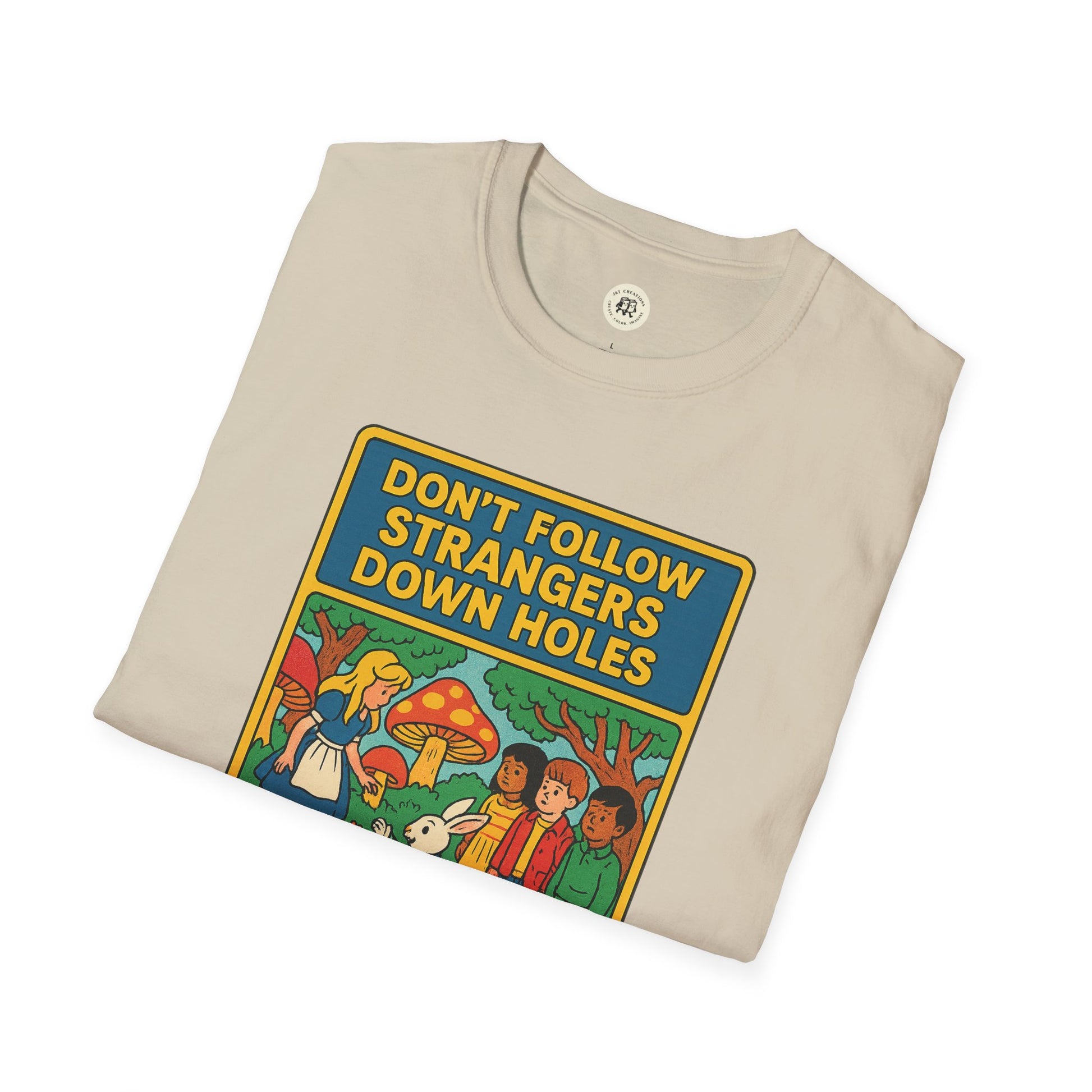 Alice in Wonderland graphic tee featuring colorful Don’t Follow Strangers Down Holes design