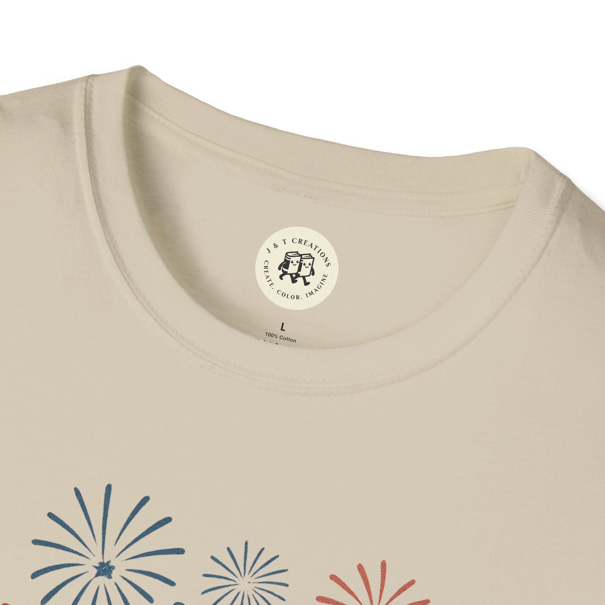 Printify beige T-shirt featuring a Fourth of July fireworks shirt design with colorful fireworks graphic