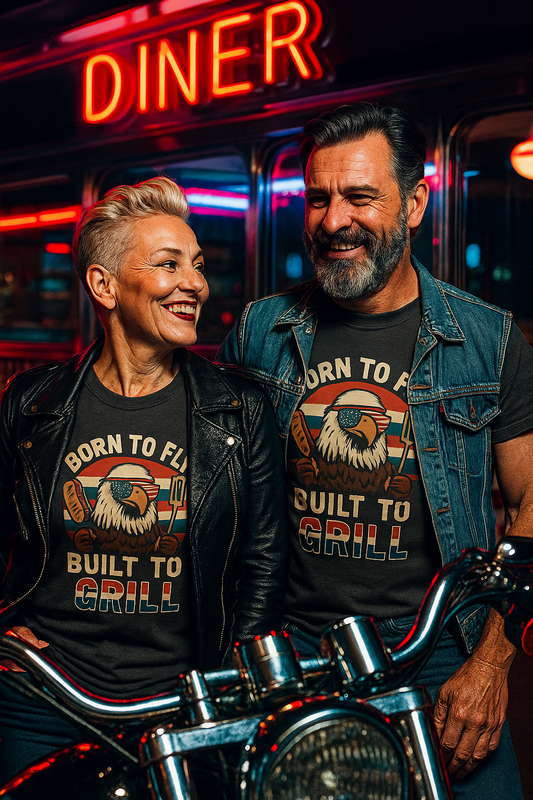 Couple wearing funny summer BBQ shirts with eagle grill design standing by motorcycle at diner