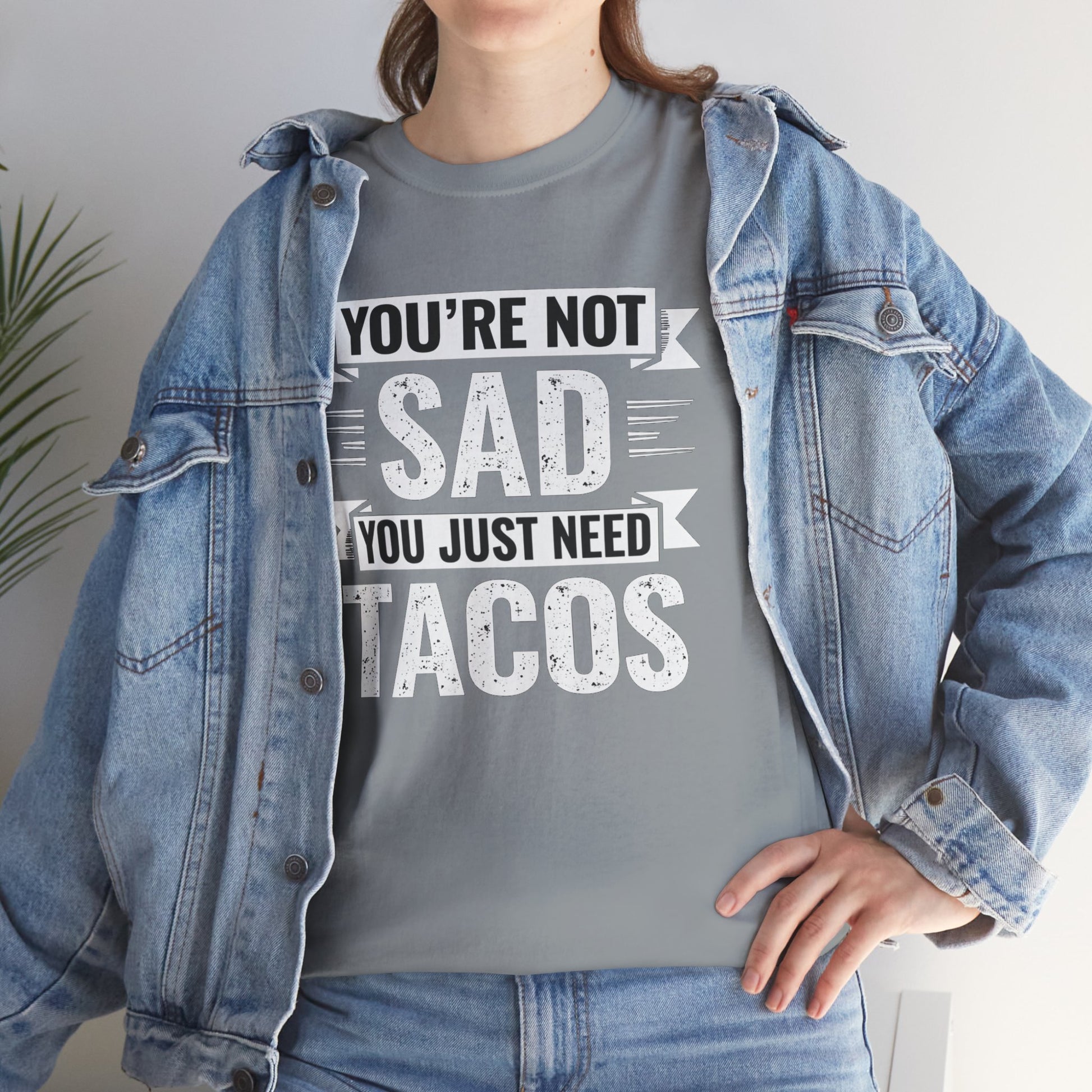 Funny taco t shirt with You’re not sad you just need tacos text worn under denim jacket