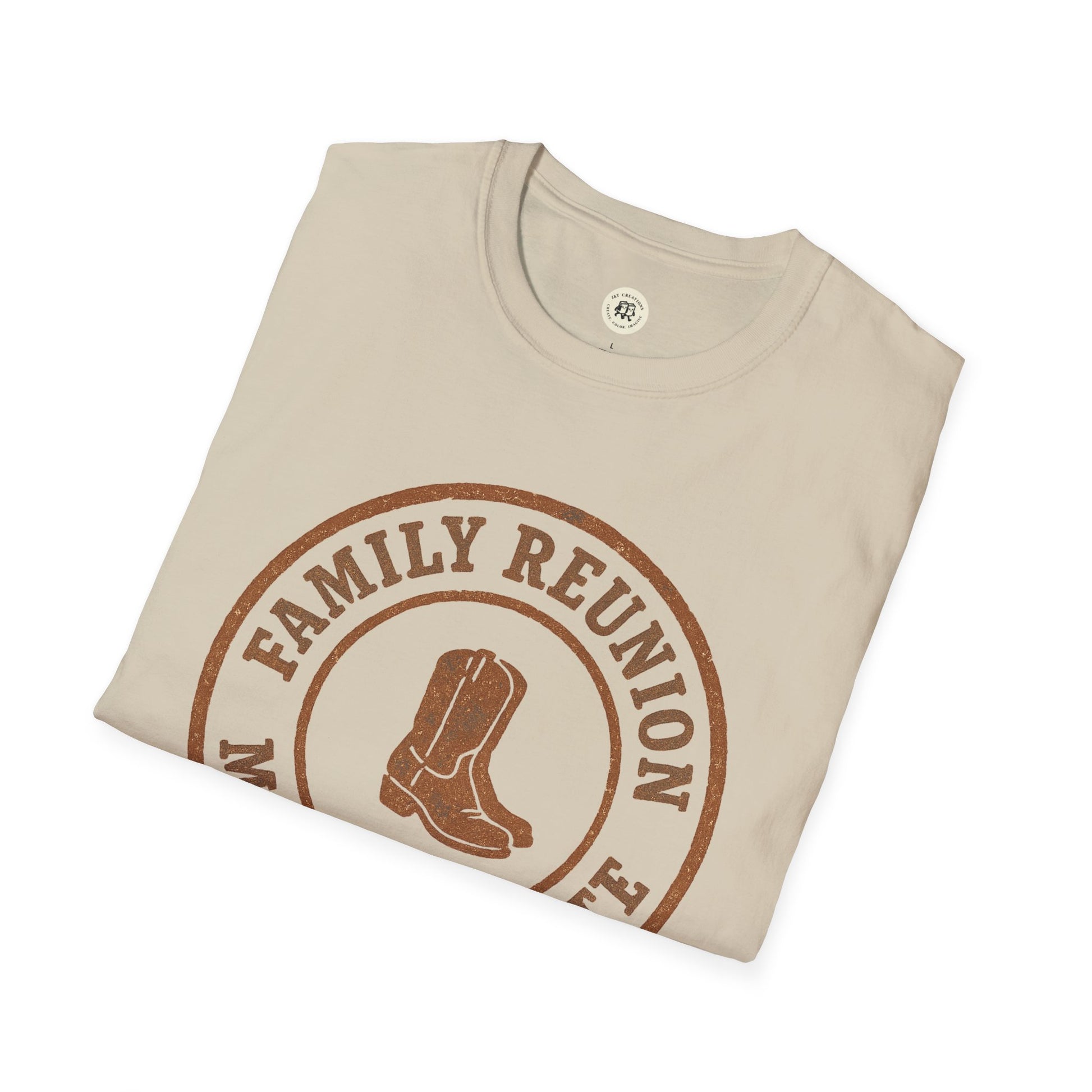 Beige Printify family reunion t-shirt with brown cowboy boots graphic folded neatly