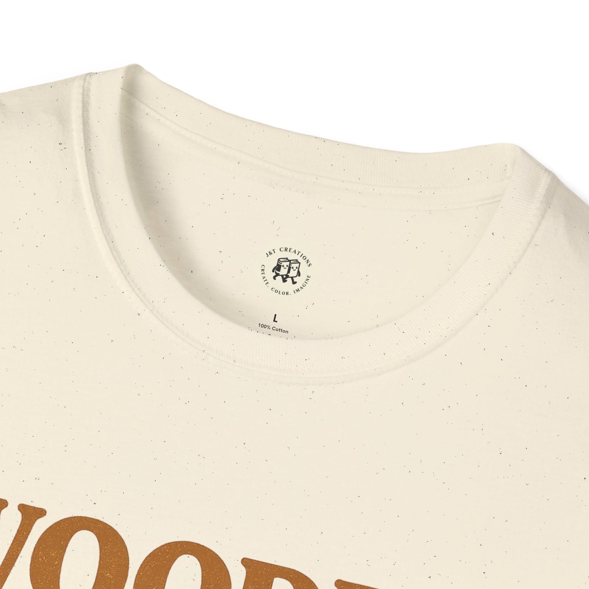 Close-up of a cream Printify wooden spoon survivor t-shirt with a round neckline and speckled fabric