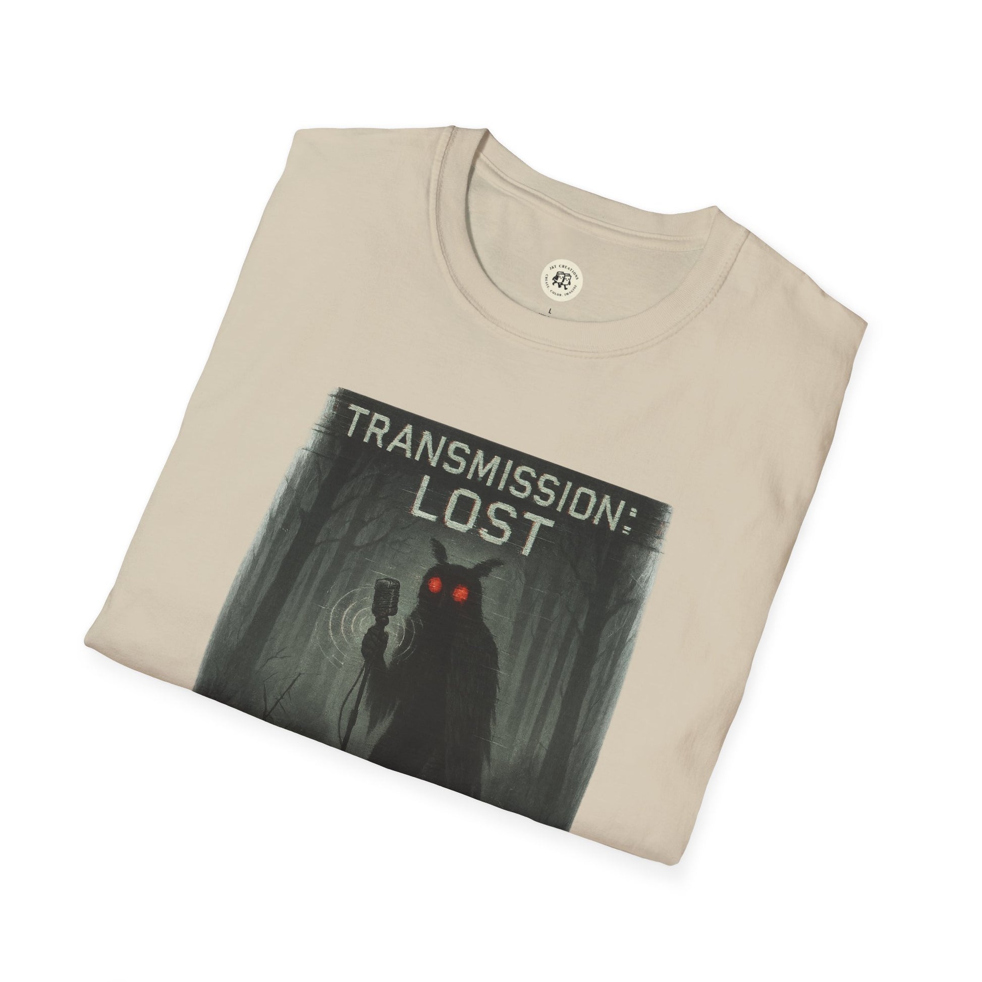 Printify beige mysterious lost transmission t-shirt featuring dark forest and glowing red eyes design