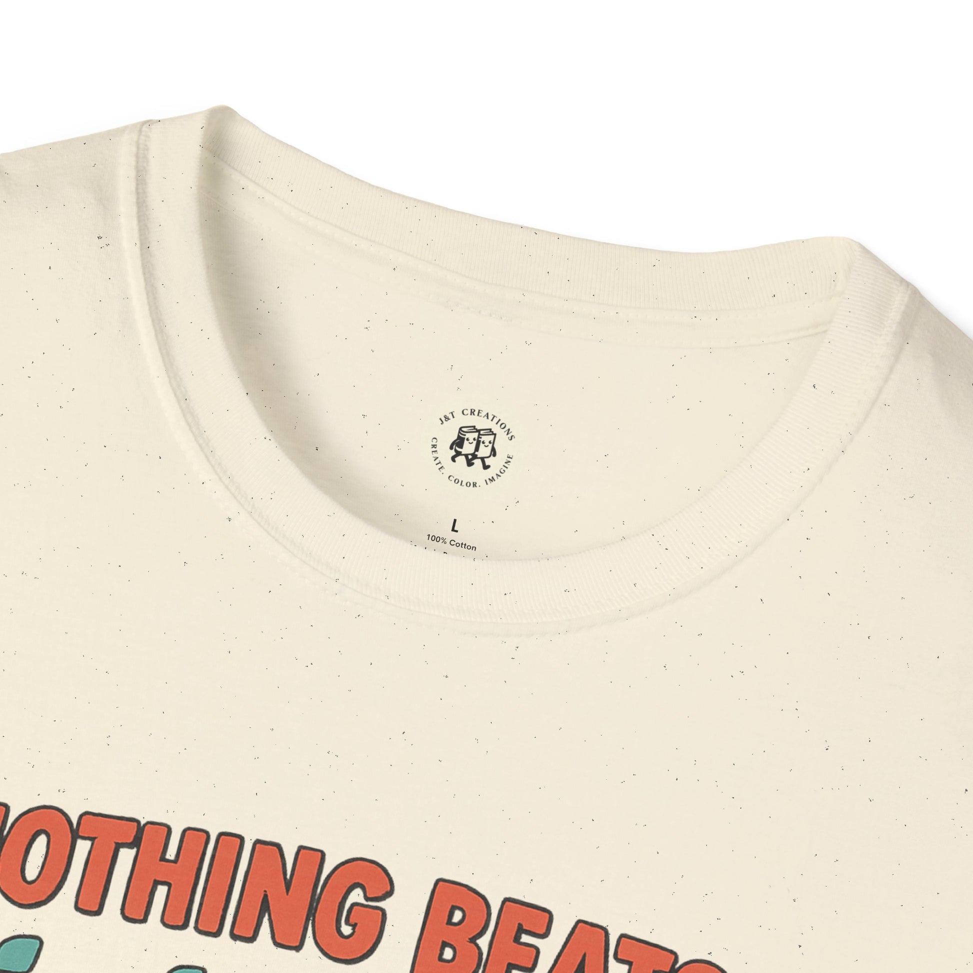 Close-up of Printify jet2 holiday t-shirt cream fabric with speckled texture and printed text design