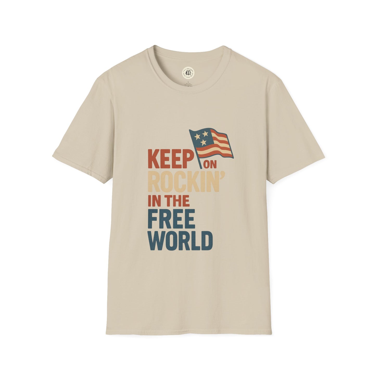 Beige Printify T-shirt with Keep on Rockin in the Free World shirt text and American flag graphic