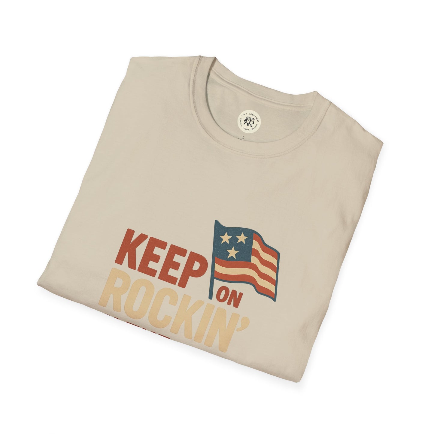 Beige Printify T-Shirt with Keep on Rockin in the Free World shirt design featuring vintage American flag graphic